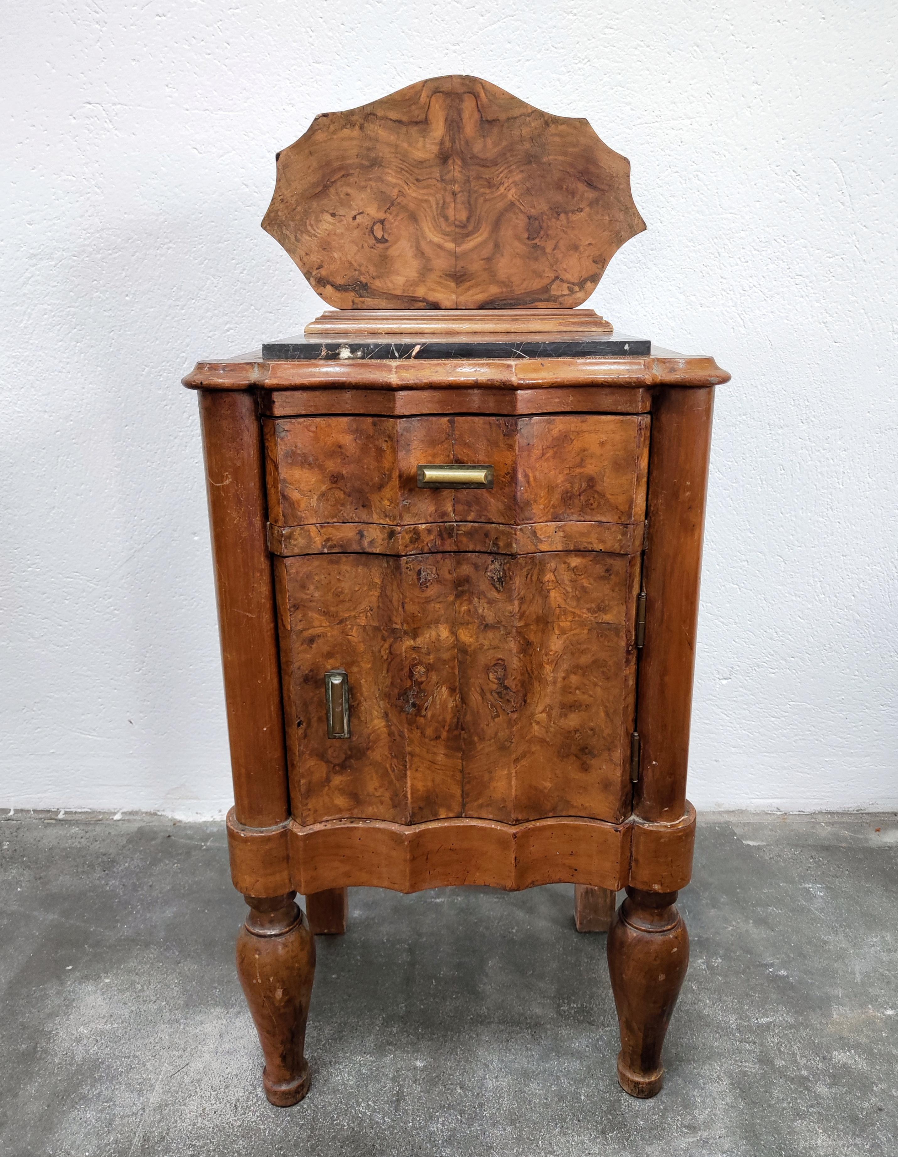 In this listing you will find a pair of spectacular Art Deco Nightstands done in Walnut Burl and marble tops. Nightstands feature small drawer and the small cabinet beneath it. 

This pair of bedside cabinets comes in its original state. You can