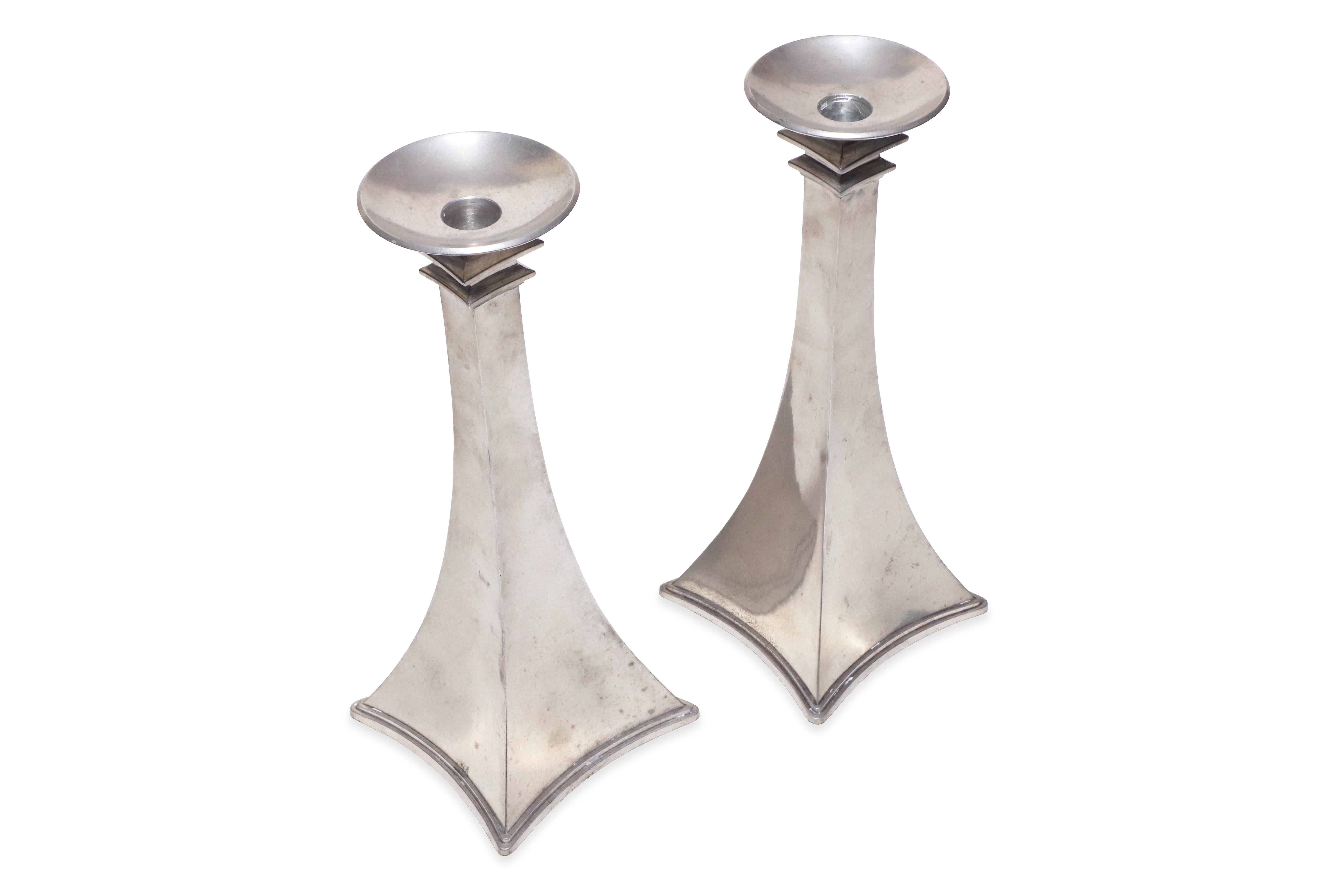 Pair of beautiful Art Deco pewter candlesticks by Just Andersen. circa 1920. Marked JUST DENMARK 2609. 

Property from esteemed interior designer Juan Montoya. Juan Montoya is one of the most acclaimed and prolific interior designers in the world