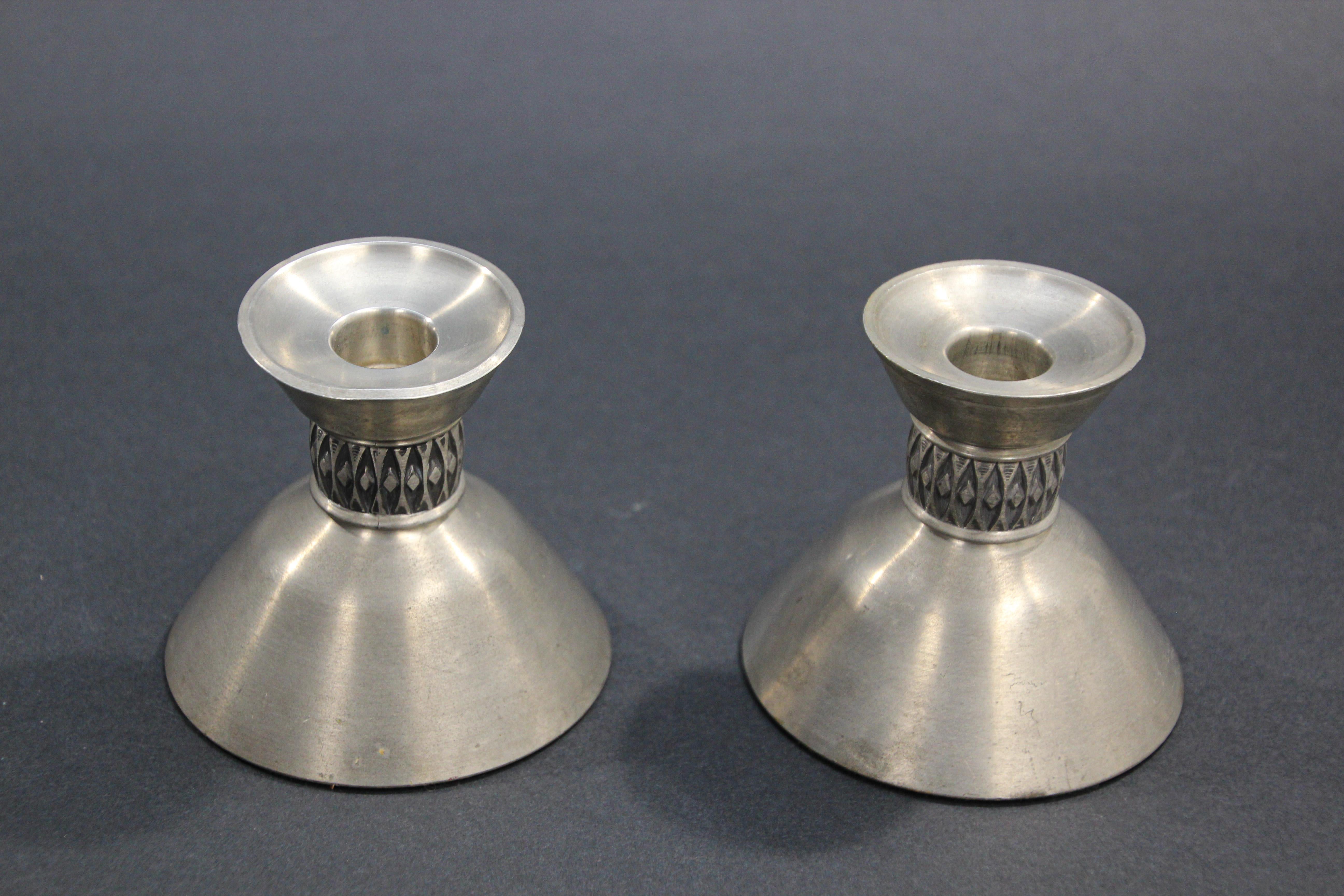 Midcentury handcrafted pair of Pewter candle holders by Mastad Norway Model 101, 
Midcentury 1950s candlesticks are unique and are in excellent vintage condition.
Pewter Candle holders made by Mastad Pewter, Norway and signed 101 which is the