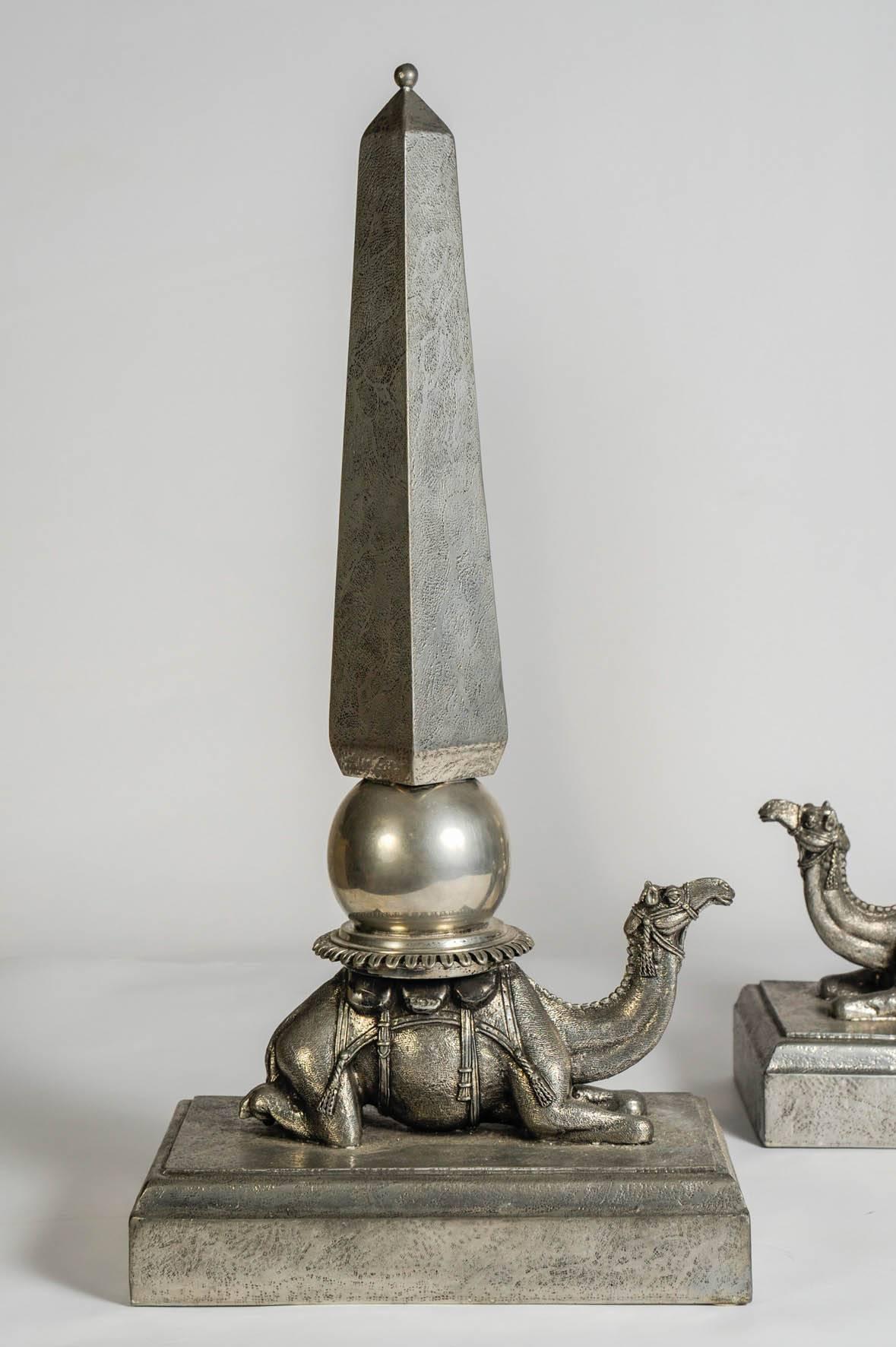 Fantastic pair of pewter showing a camel carry on an obelisks 
Signed Figura Piero
For Atena.