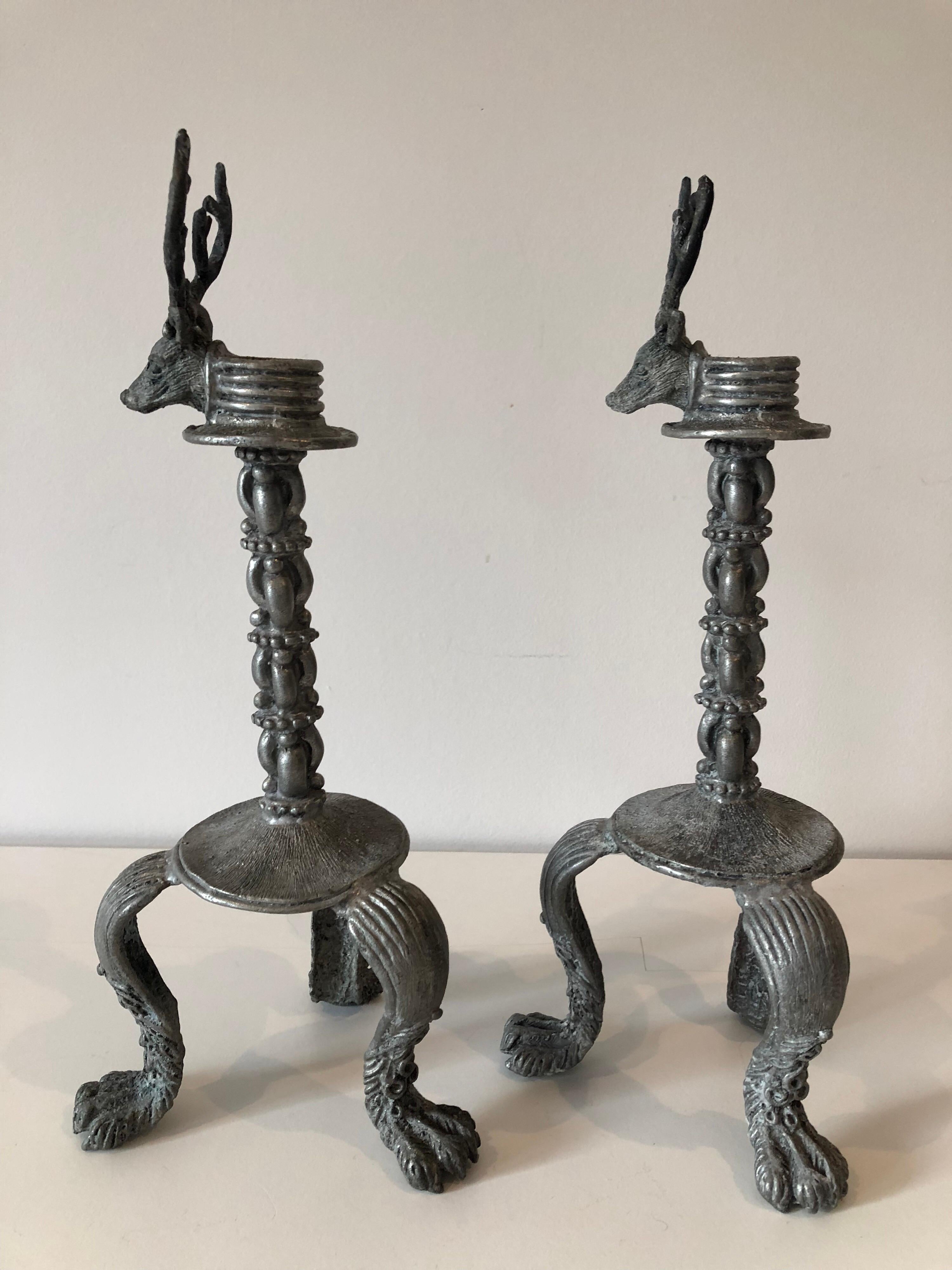 A pair of late 20th century artisan made pewter stag candlesticks. Raised on paw form legs. Inscribed with the artist signature and year '92.