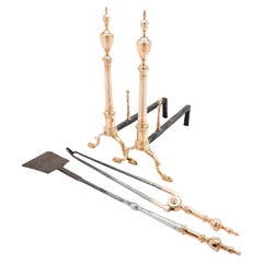 Pair of Philadelphia bell metal andirons with paired fire tools, c. 1790