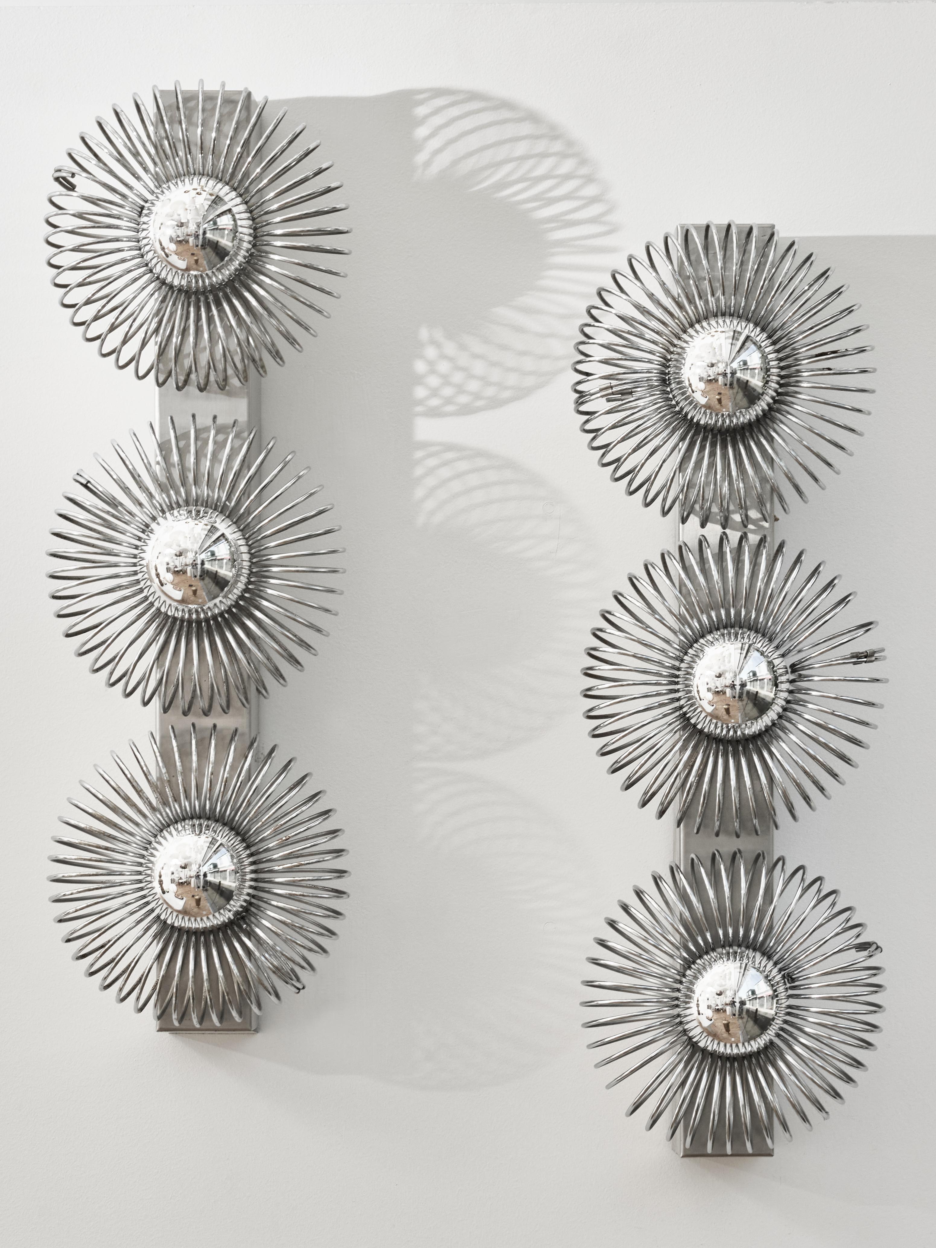 Pair of wall sconces designed by Philippe Rogier by Luminor/Oxar in the 1970s.

Specialized in stainless steel pieces, these sconces are typical of both of their works. 
They feature stainless steel rectangular structure and three sources of light.