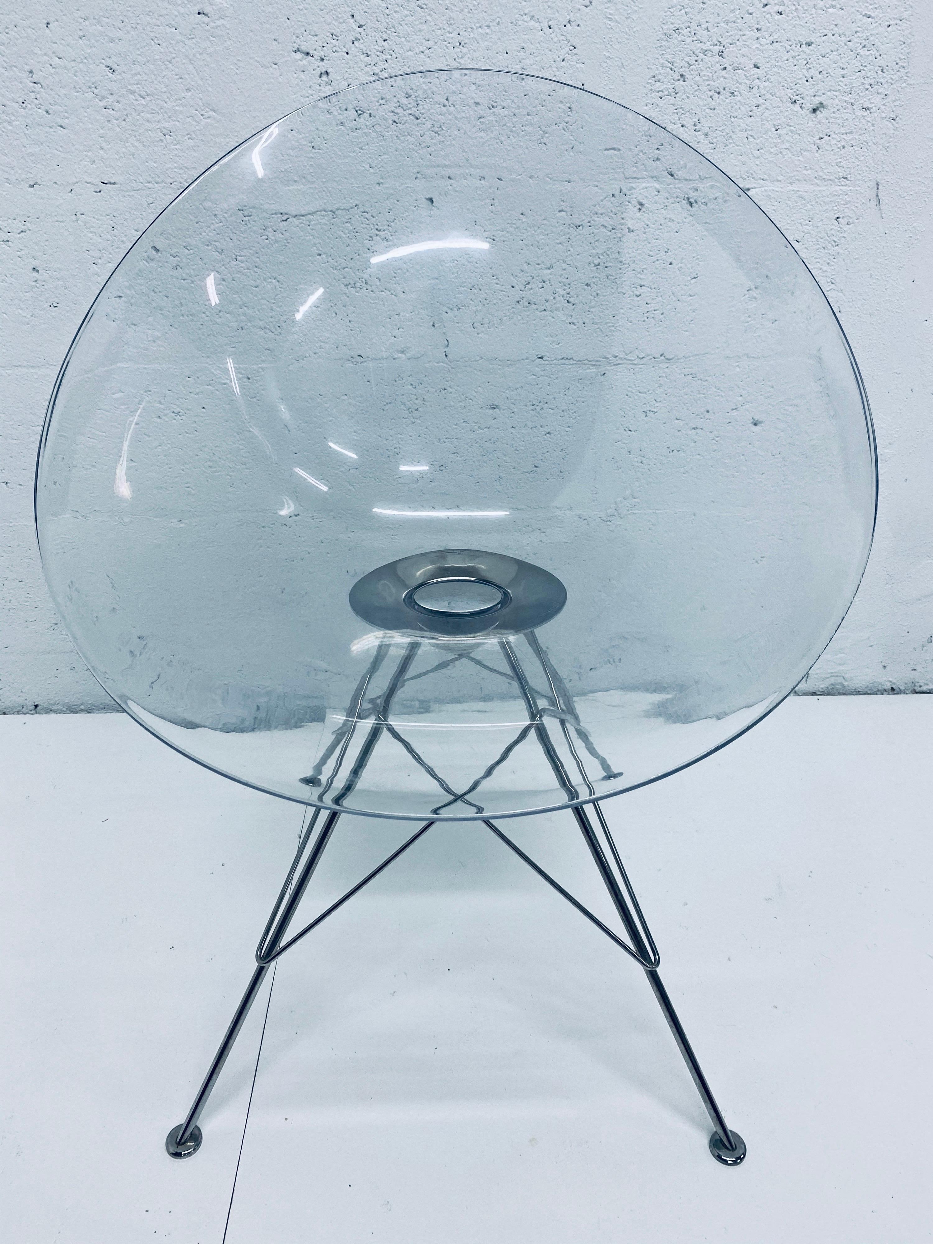 Set of two clear ghost Eros chairs with chrome Eiffel Tower base designed by Philippe Starck for Kartell.