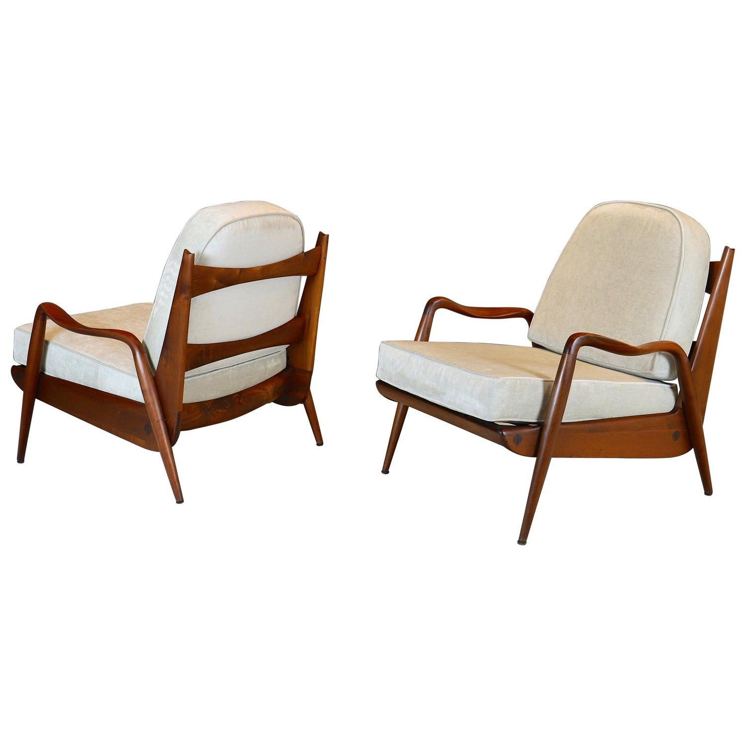 Rare pair of hand-sculpted walnut lounge chairs by New Hope studio artist Phillip Lloyd Powell, circa 1970s.
These chairs were a part of a very small studio production.
Their design is one of Powell's most iconic and successful, therefore sought