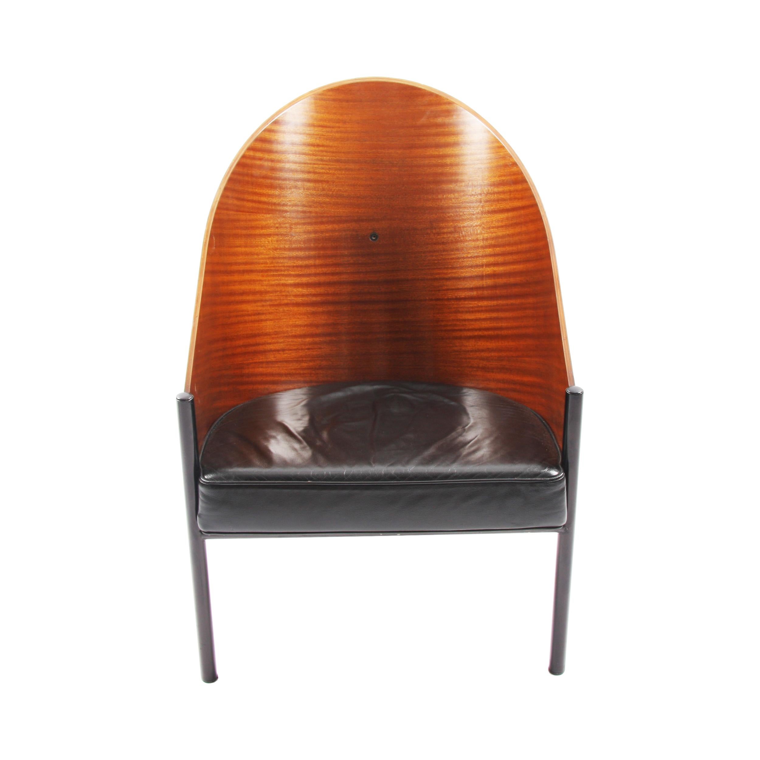 This gorgeous pair of lacquered molded wood and leather chairs were designed by Phillippe Starck in 1982 for the Costes Café in Paris. 

These chairs have a striking, yet simple design and feature black tubular steel legs. 

Dimensions: Full
