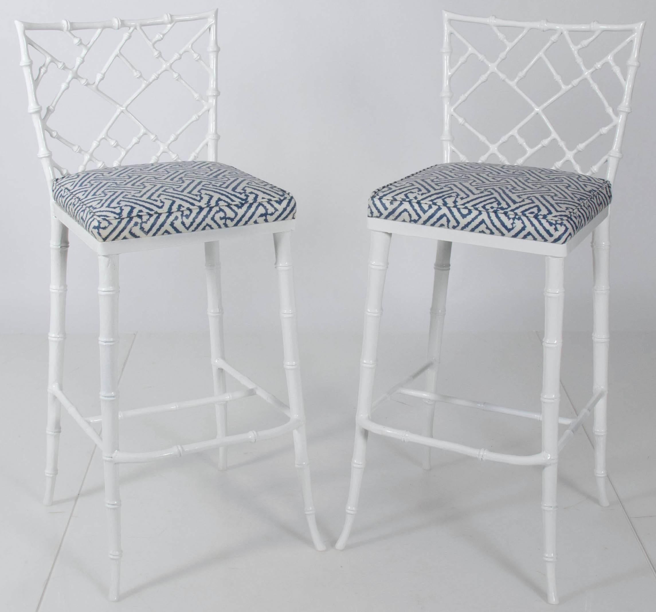 Pair of Phyllis Morris faux-bamboo tall metal barstools. Newly powder coated in gloss white. Upholstered in Quadrille 'Java Grande' in medium blue/white. Fabric has been clear-coated to repel stains. Suitable for indoor/outdoor use.
