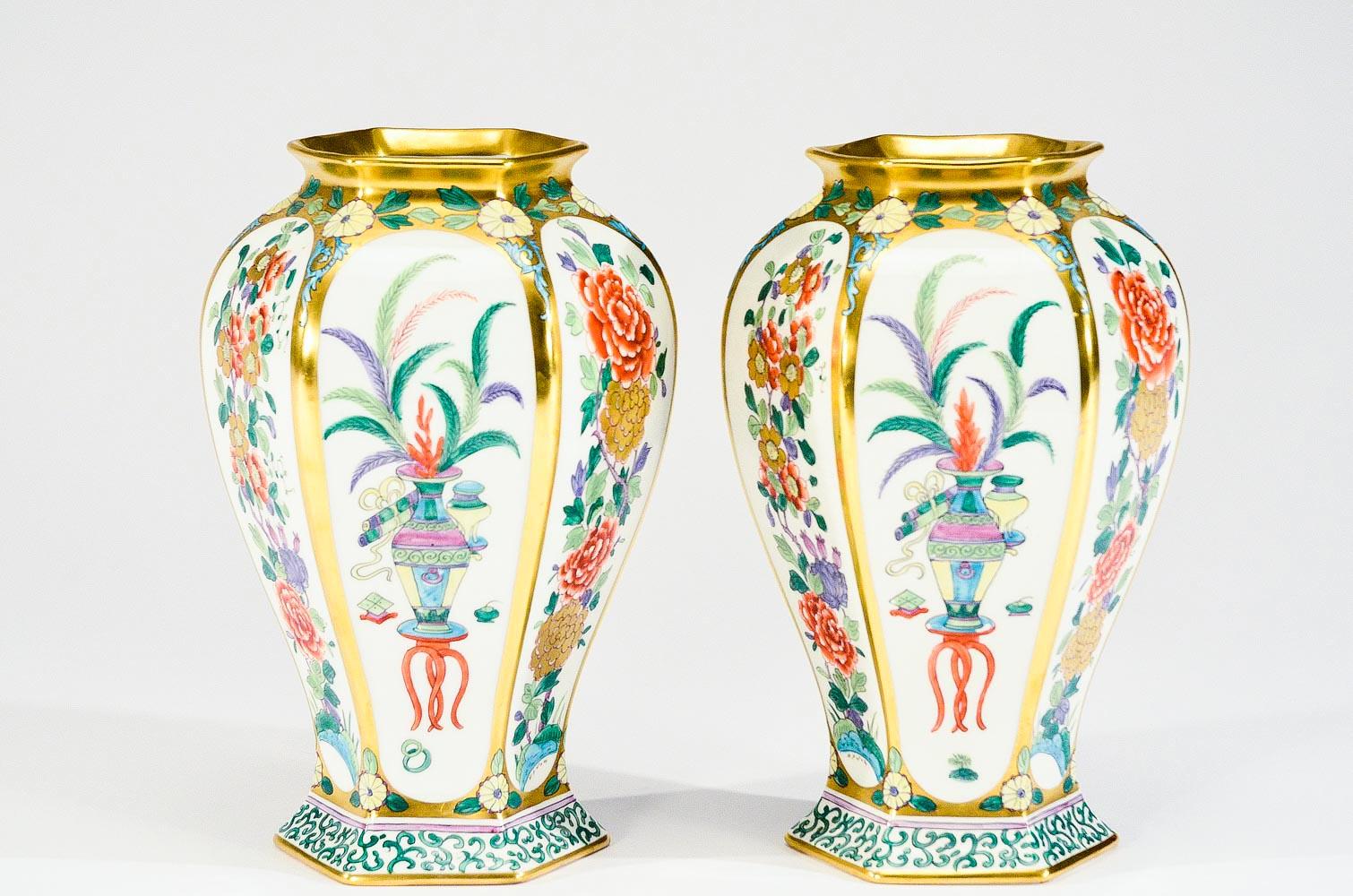 This pair of porcelain vases were custom order and uniquely studio painted as described on the base: 