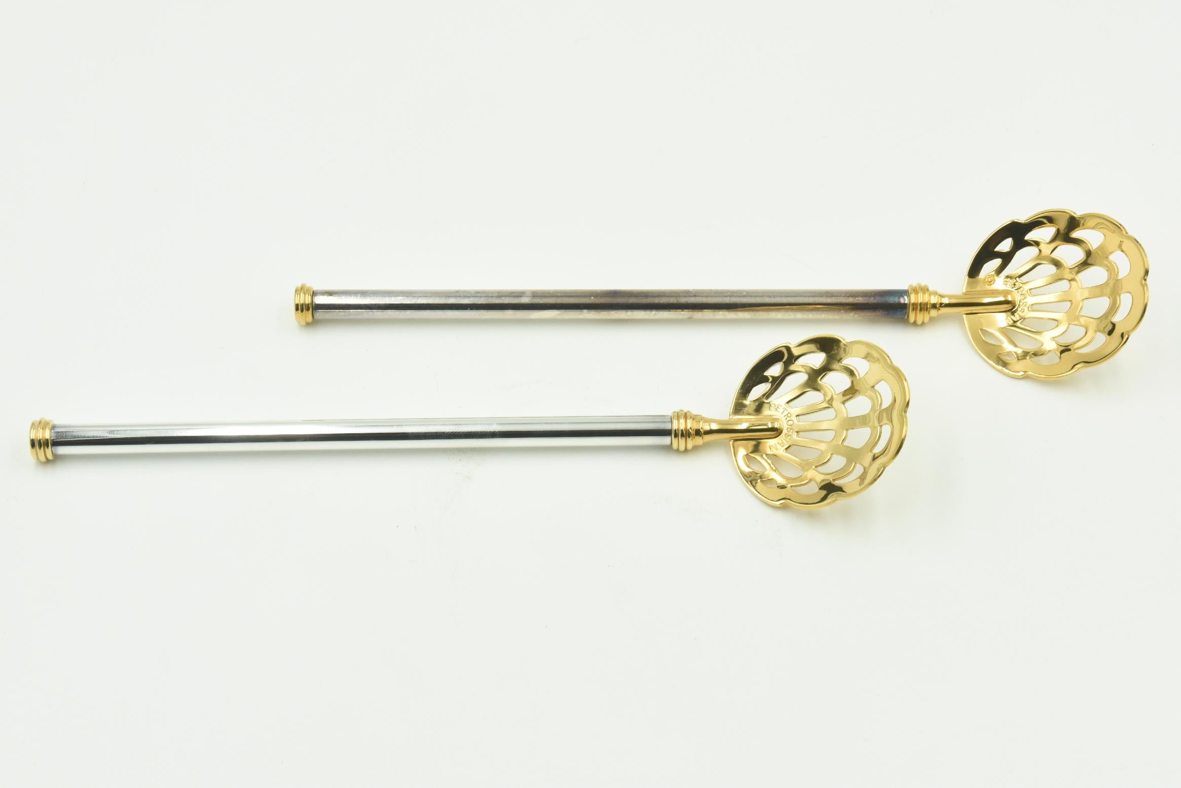 Vintage pair of Caviar pierced serving spoons by Petrossian featuring a gold plated pierced spoon and tip and a silver plated handle.

For nearly 90 years, the Petrossian family has served some of the finest caviar to connoisseurs across the