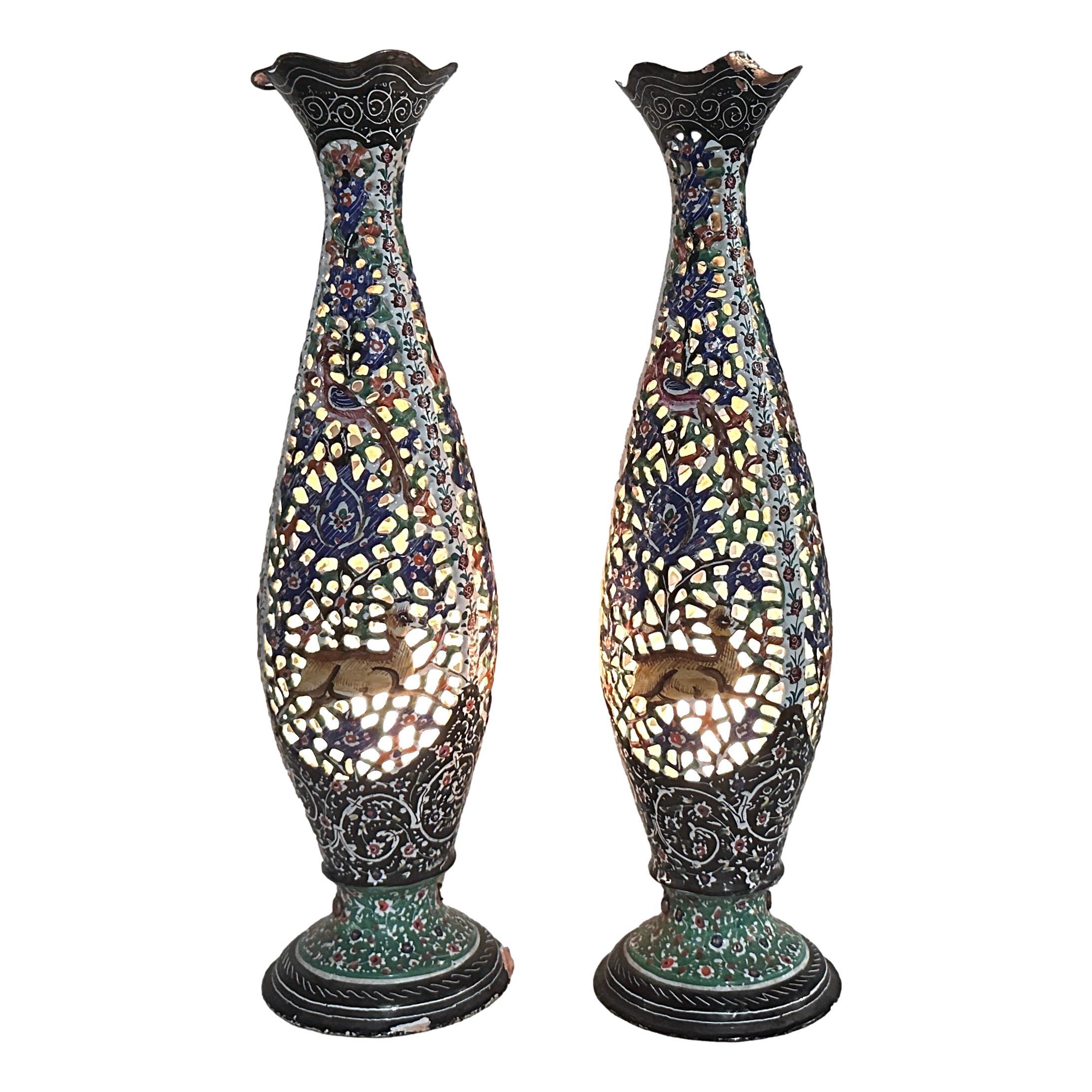 Pair of circa 1960’s Persian enamelled copper table lamps with interior light.

Measurements:
Height: 14″
Diameter: 3.75″