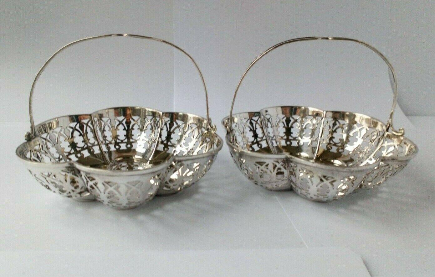 Pair of Pierced Sterling Silver Bonbon Dishes by James Deakin & Sons

In very good condition, this is a beautiful pair of dishes. They would look lovely with sweets, nuts or even as they are. Hallmarked: Made by James Deakin & Sons (John & William F