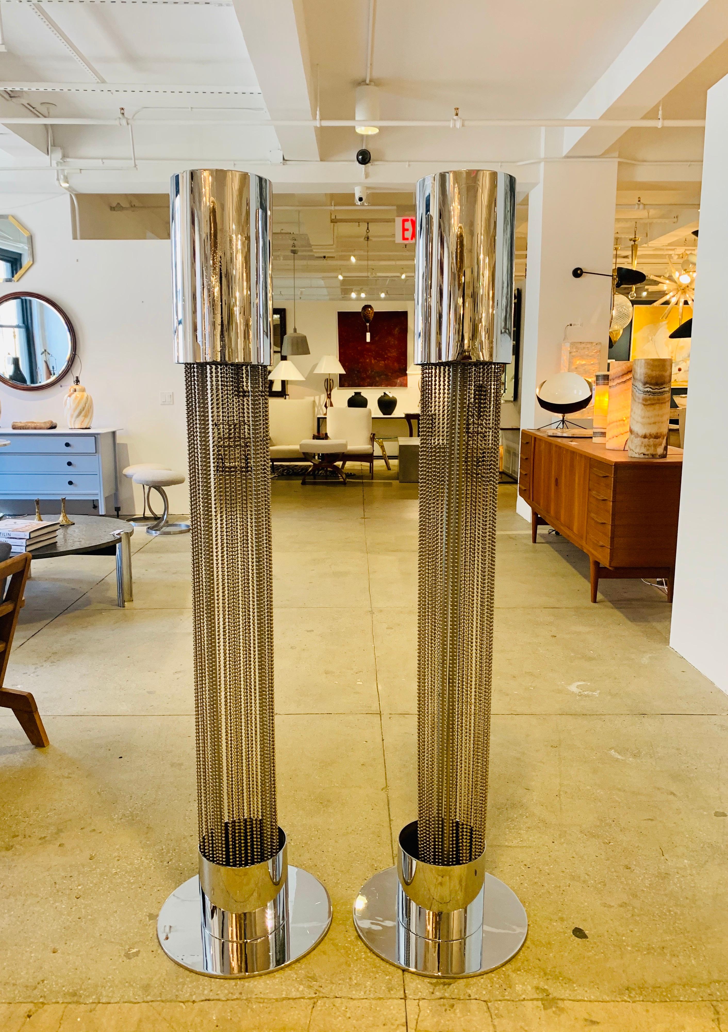 A statement pair of 1970s French dramatic polished chrome and beaded floor lamps by famed designer, Pierre Cardin. Rewired.