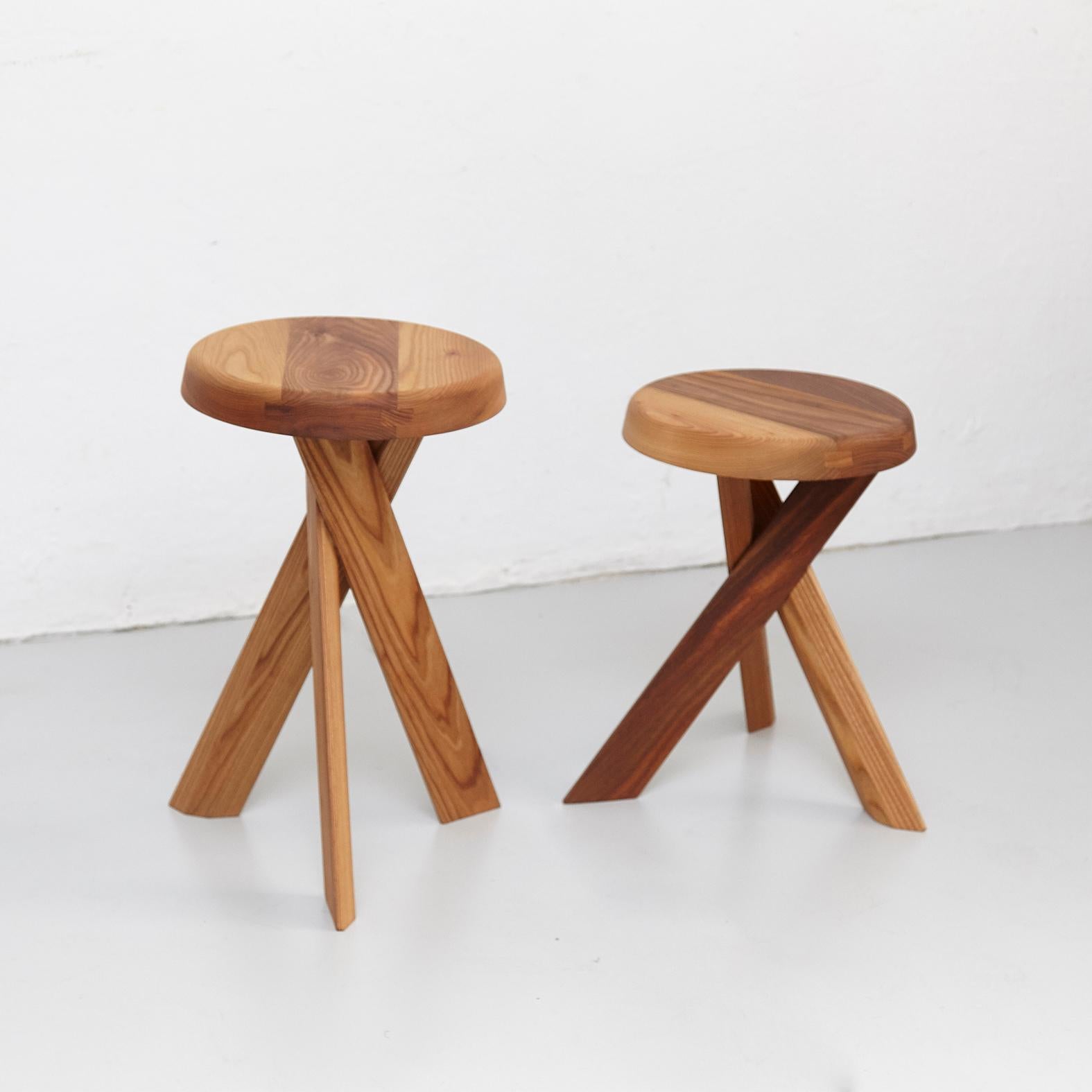 Stools designed by Pierre Chapo, circa 1960.
Manufactured by Chapo Creation in France, 2019.
Elm oakwood.

Measure: 33 cm x 45 cm
33 cm x 55 cm

In good original condition, with minor wear consistent with age and use, preserving a beautiful