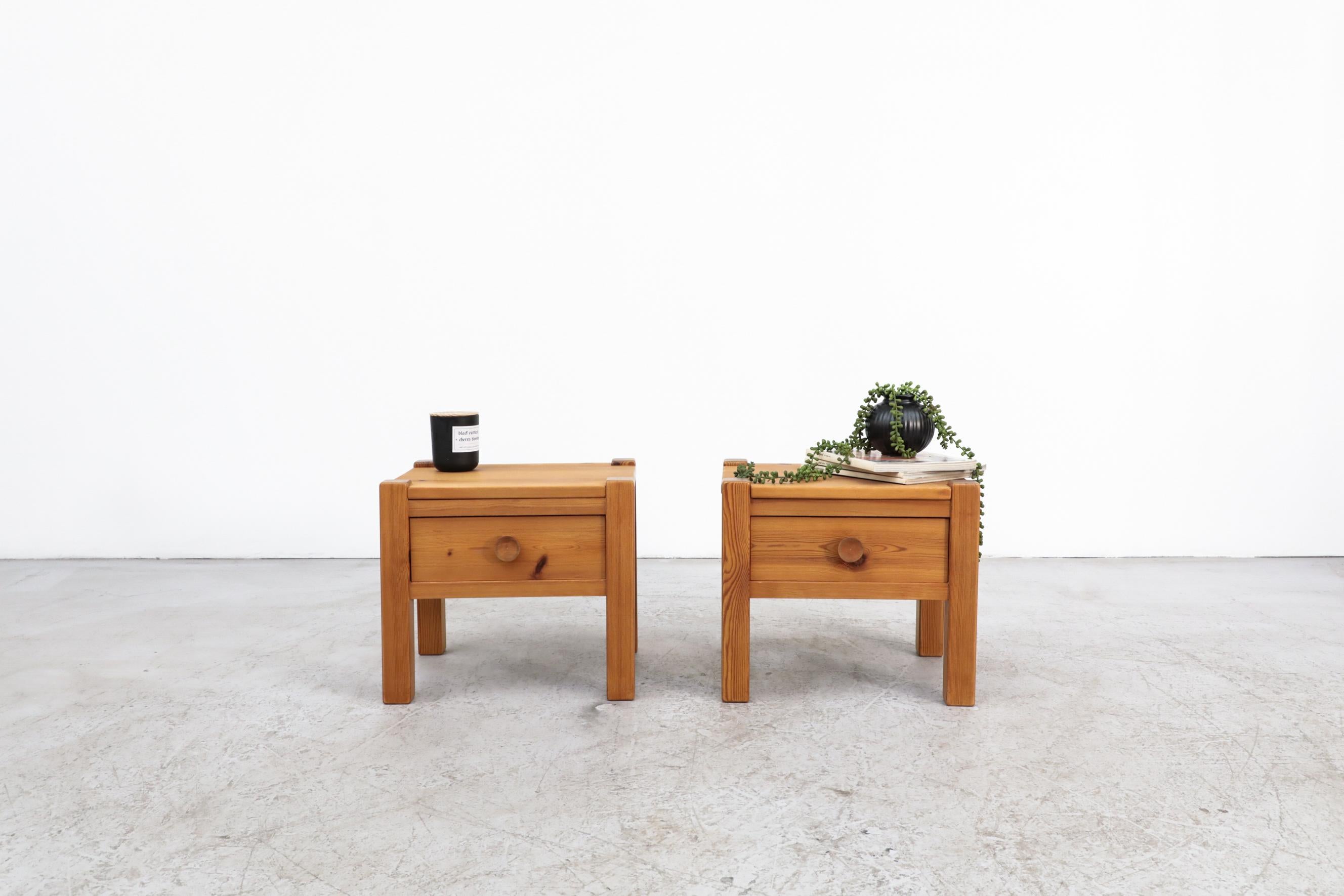 Cute little pair of pine nightstands inspired by Pierre Chapo with large button like drawer pulls. In good original condition with wear consistent with age and use.