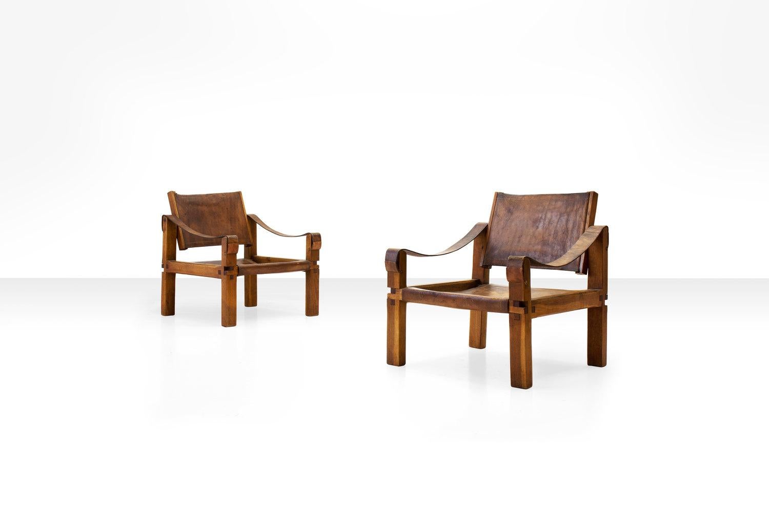 Pair of Pierre Chapo S10 Easy Chairs in Cognac Leather and Oak, France 1960s.  

Designed in the 1960s and produced in solid elm and cognac leather, the s10 chair is one of the most elemental works in Chapo's oeuvre. The chair combines a complex