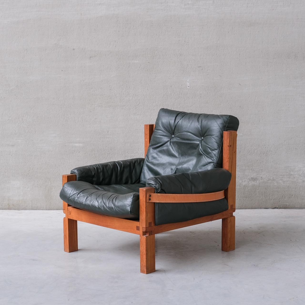 A pair of Pierre Chapo armchairs. 

S15 model. 

France, circa 1970s. 

Elm and leather. Exposed joints a signature of Chapo. 

Original leather cushions in green remain in good condition. 

Location: Belgium Gallery. 

Dimensions: 80 W