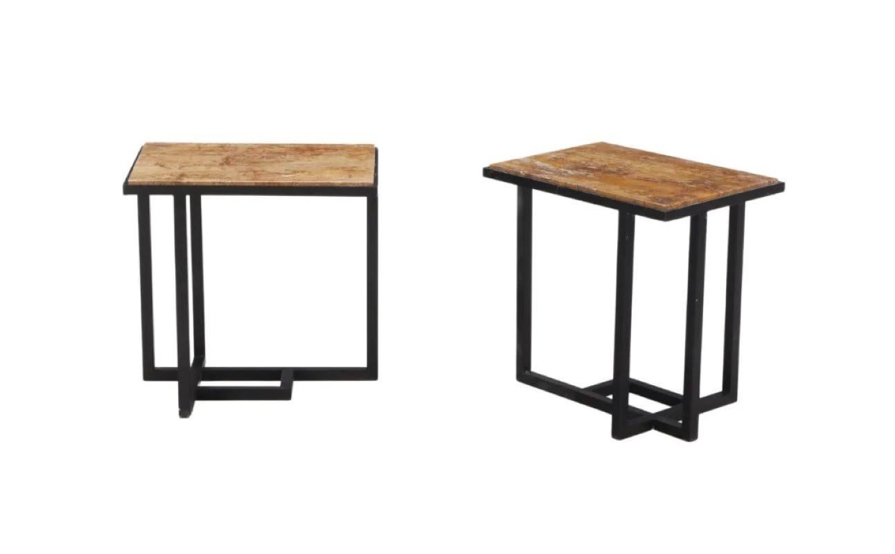 Pair of midcentury French iron end tables in the style of Pierre Chareau, circa 1960. Warm marble tops sit atop tubular iron geometric table bases for a modern and airy look. 