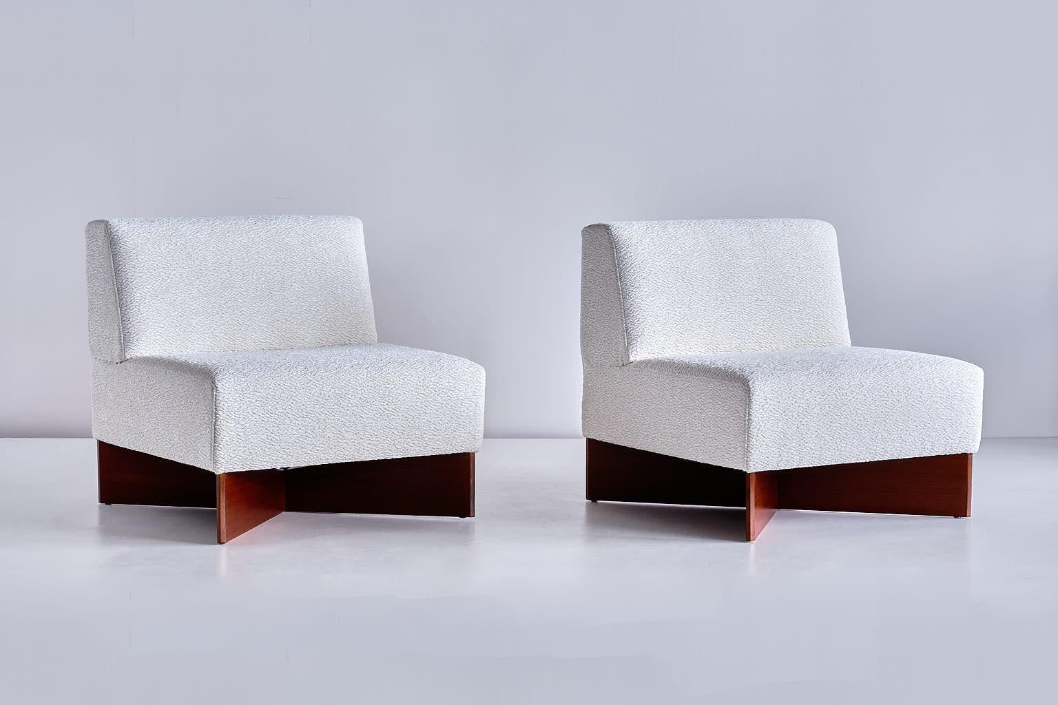 This lounge chair model known as CA-21 or Capitole was designed by Pierre Guariche and produced by Les Huchers-Minvielle in the early 1960s. The striking X-shaped teak legs and geometric forms give the chairs a modern, architectural feel.

The