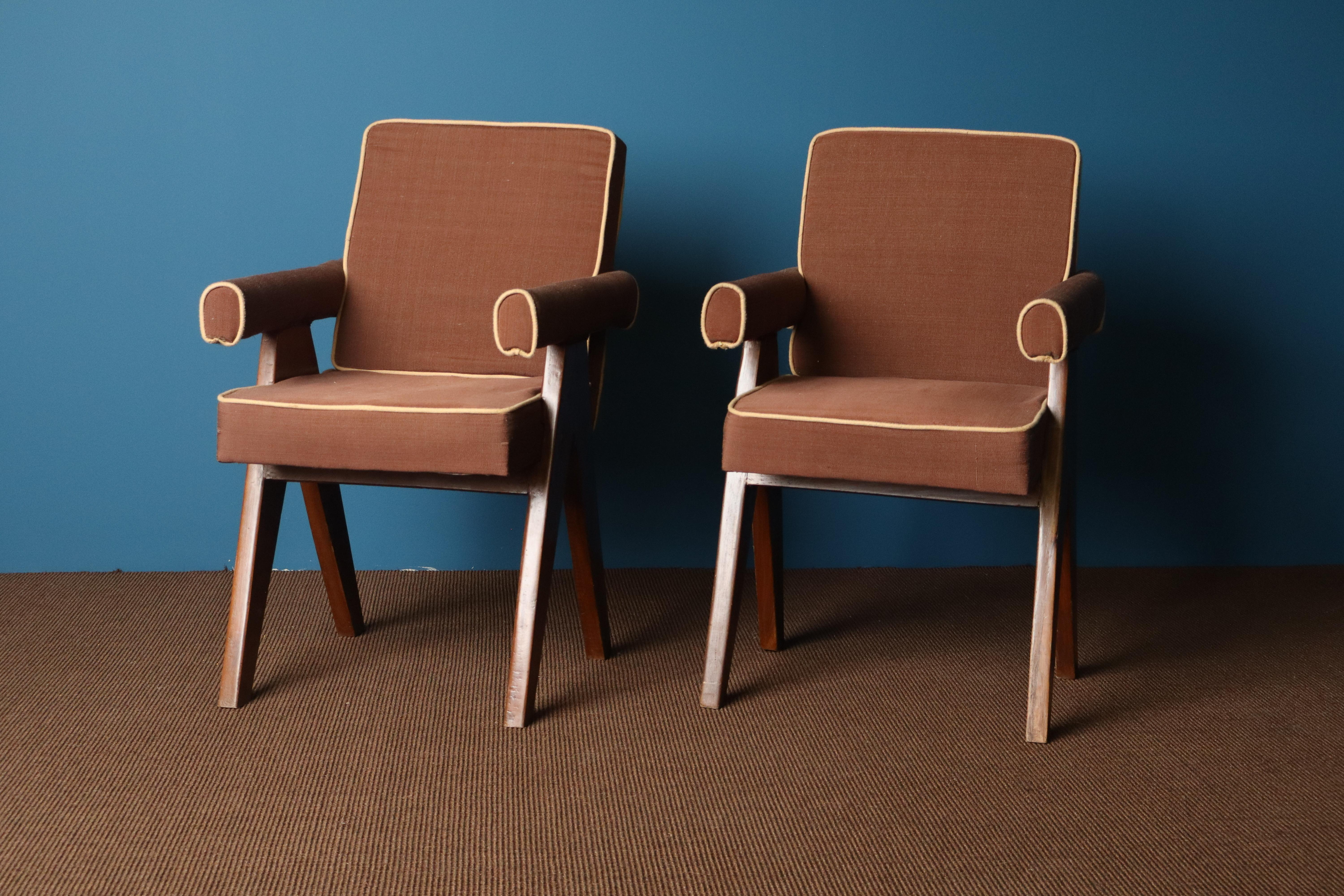 A rare pair of committee chairs designed by Pierre Jeanneret for the Chandigarh administrative buildings, circa 1955–1960.

Crafted from solid teak, these chairs feature the signature angular compass legs, rolled armrests, and cushioned seats and