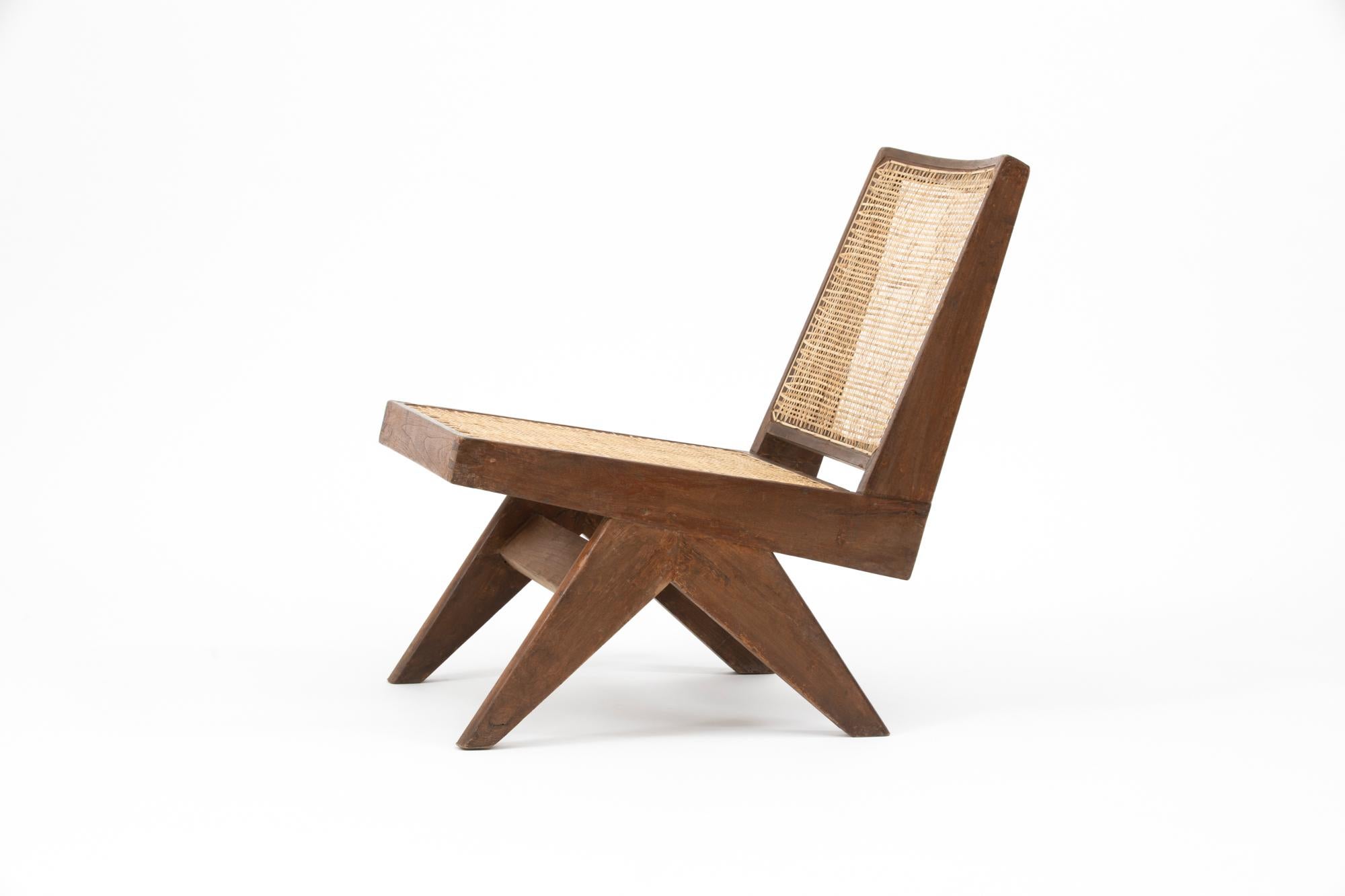 Low lounge chairs, designed by Pierre Jeanneret for the famous modernist capital city of Chandigarh, India that was designed by Le Corbusier, Jeanneret and their team. Model number is PJ-SI-35-A.