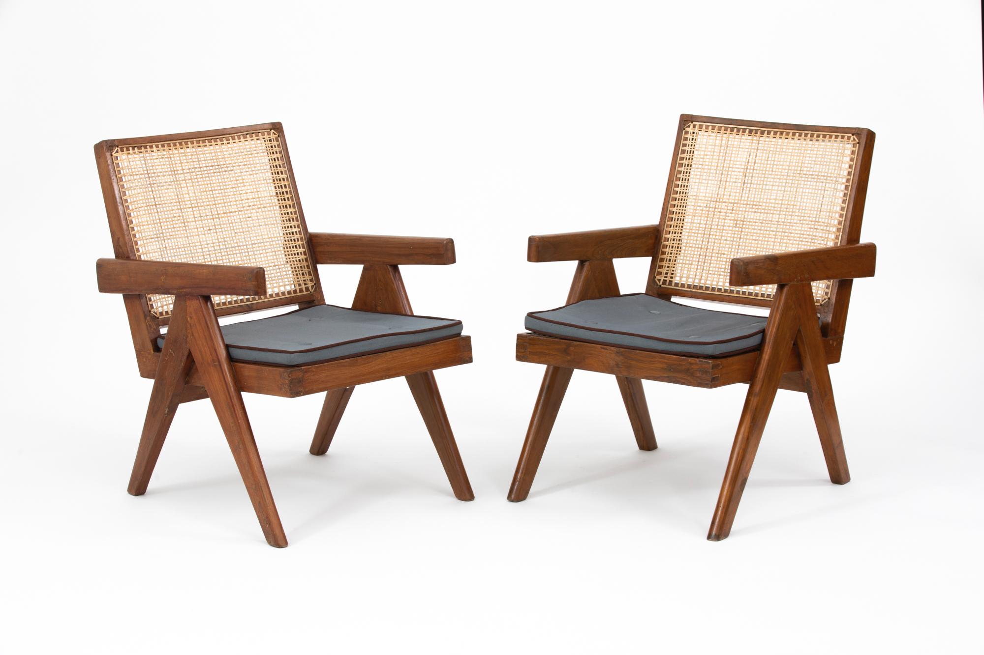 Original teak and wicker low lounge chairs with cushion, designed by Pierre Jeanneret for the famous modernist capital city of Chandigarh, India that was designed by Le Corbusier, Jeanneret and their team. Referenced in 