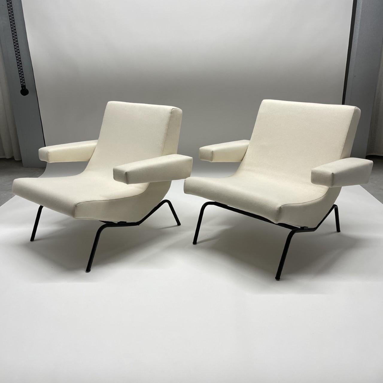 Distinctive pair of mid 20th century design armchairs, model CM 194. This pair of chairs are early works designed by the visionary designer Pierre Paulin for Thonet Furniture Company, France, circa 1958. This set of chairs has an ingenious ergonomic