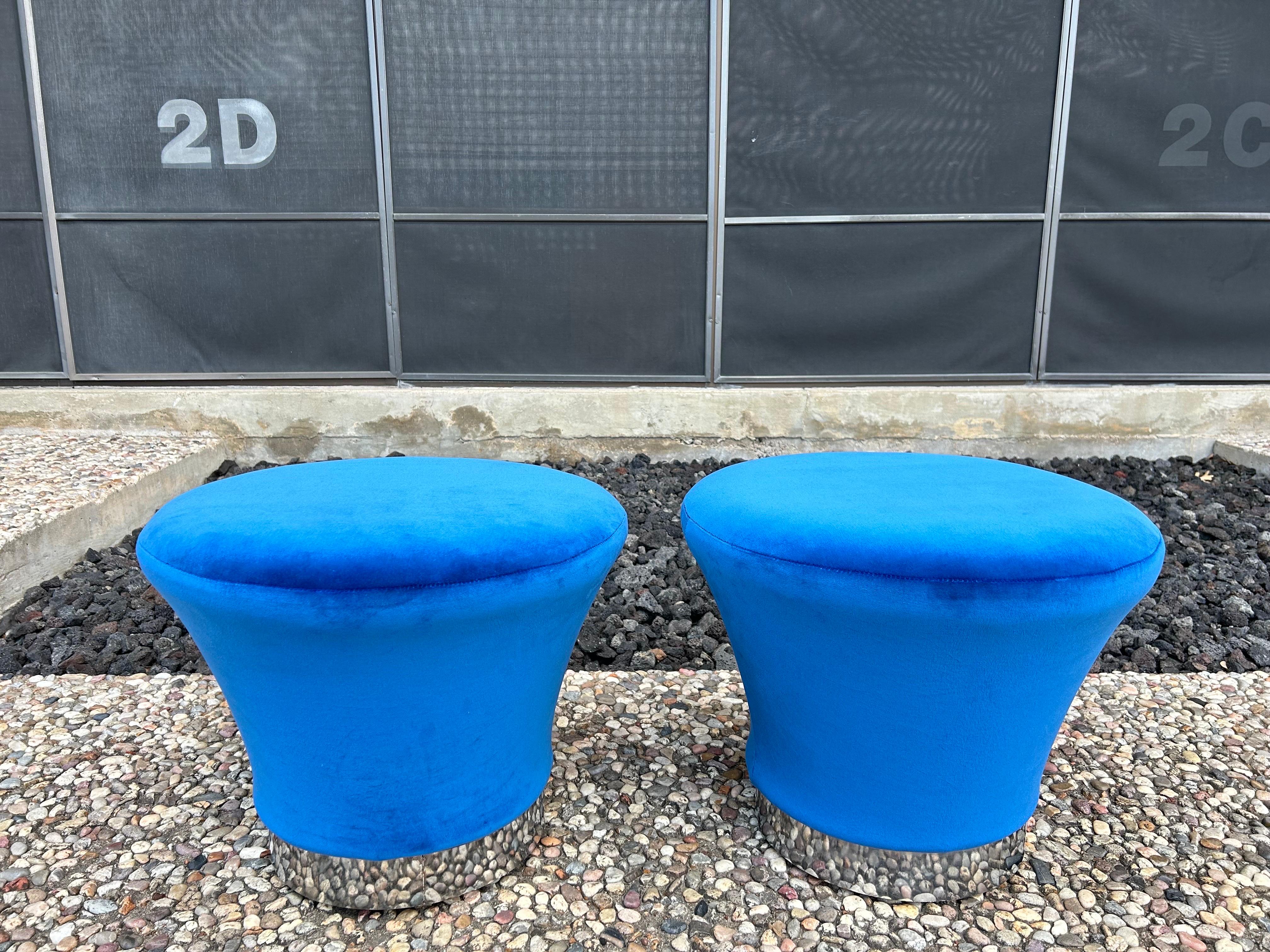 Pair Of Pierre Paulin Style Mushroom Ottomans.
This great pair of mid century modern mushroom ottomans or poufs with chrome bases have been newly upholstered in plush blue velvet.
Beautiful accent ottomans or for extra seating when needed.