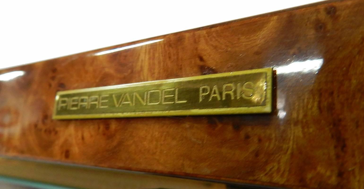 Pair of Pierre Vandel Vitrines French midcentury, circa 1970
Illuminated showcase cabinets
Original labels Pierre Vandel Paris
Each has an internal top light
Doors with locks and key
Glass shelves
High shine burr walnut top and base
Very good