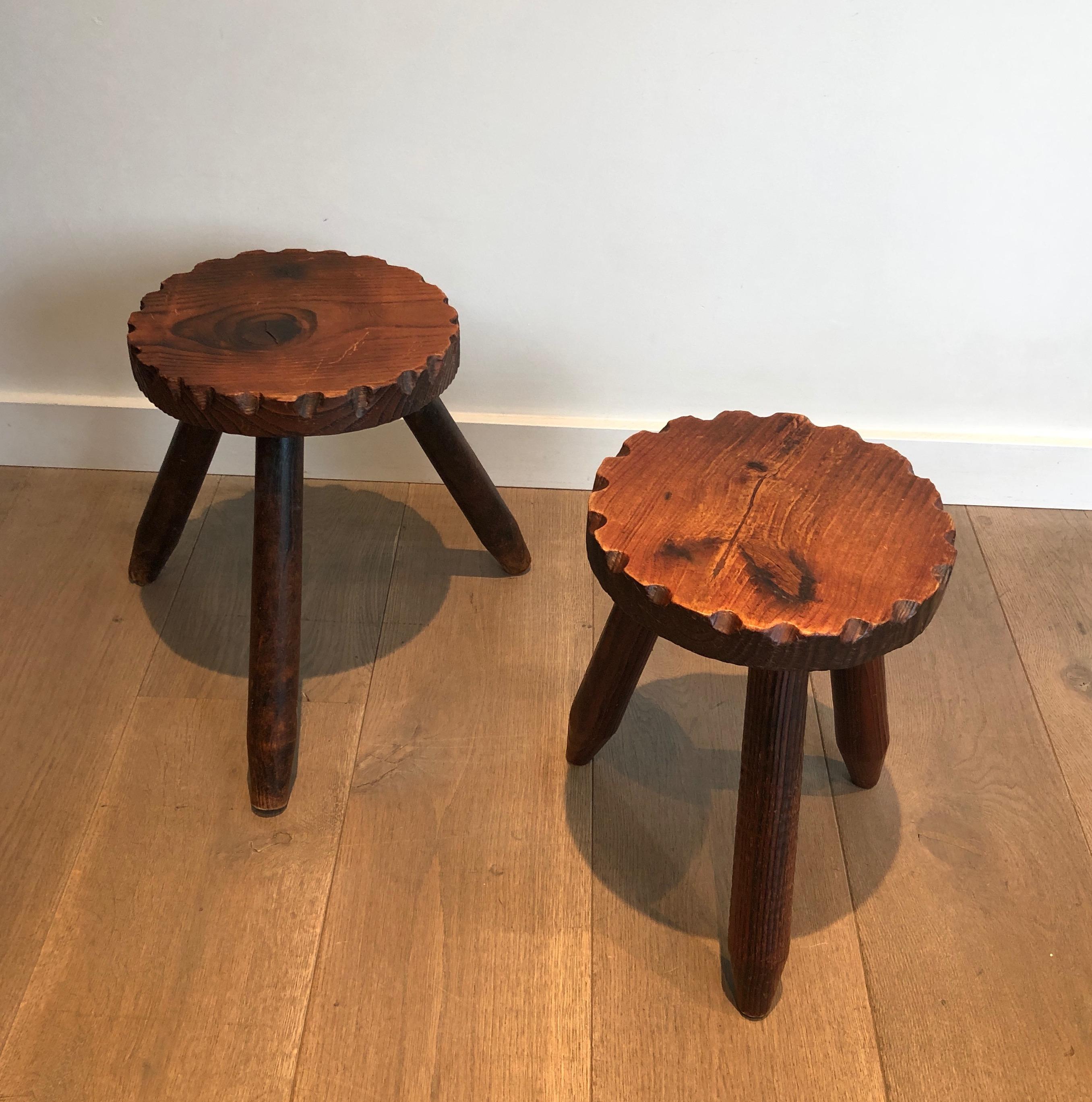 This pair of brutalist stools is made of pine. This is a French work in the style of Ateliers Marolles. circa 1950.