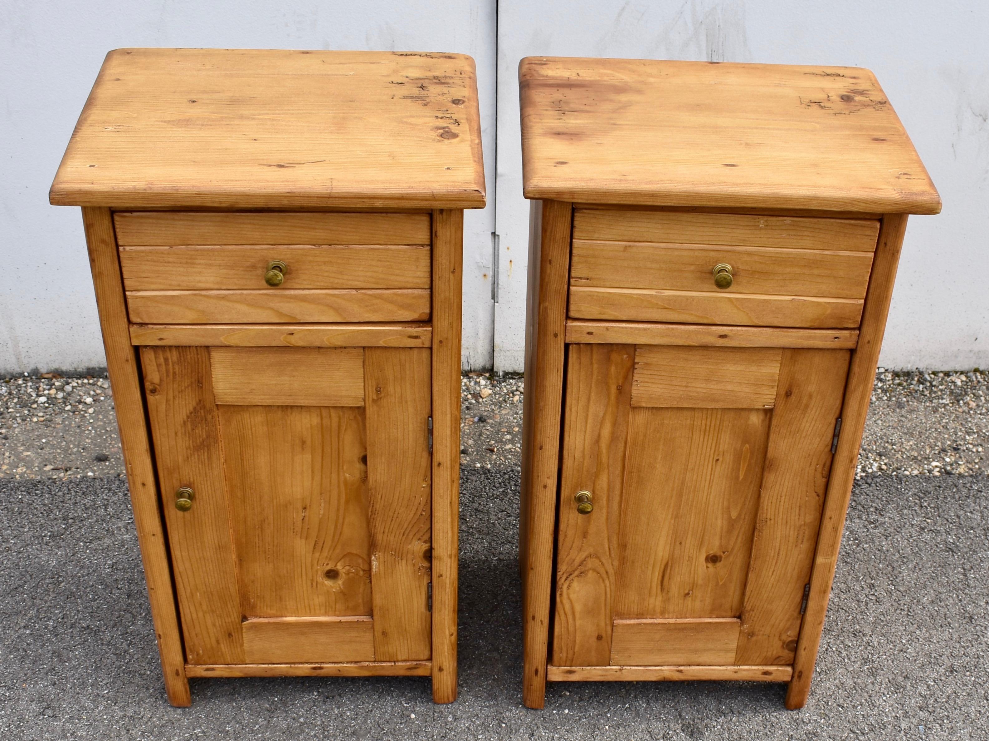 This is a matched pair of nightstands, although both pieces open on the left hand side.  Perhaps they were made to partner with a pair of twin beds and were intended to be used one per bed.  They have the usual one door and one drawer configuration.