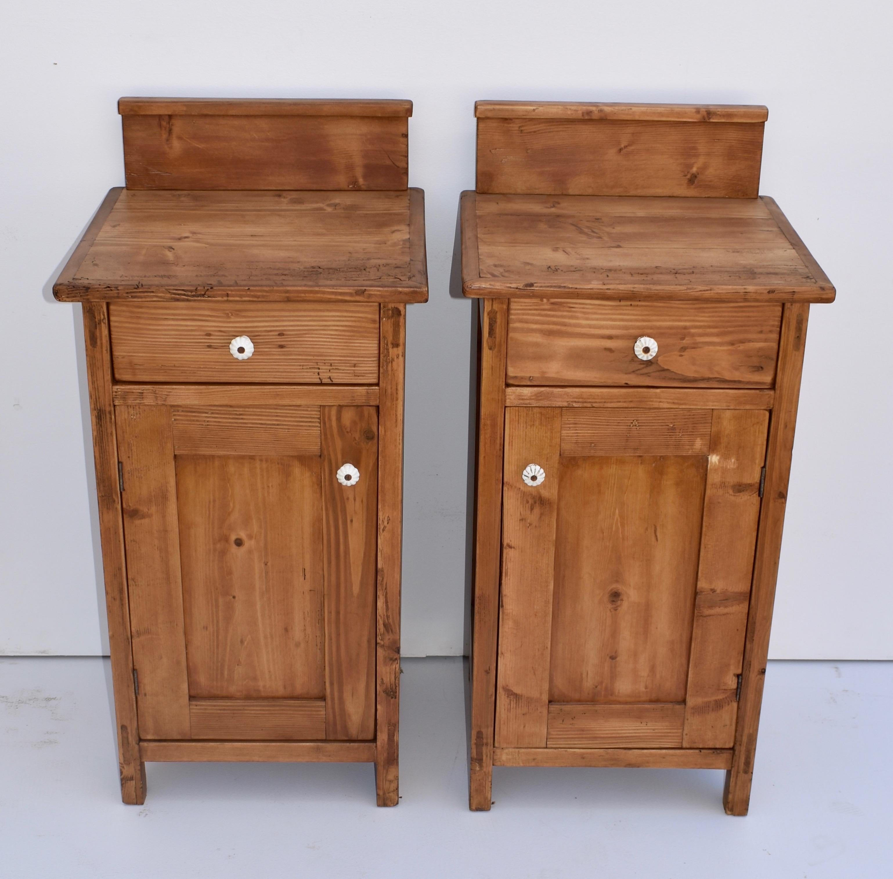 84. 23VJL84 (8323), pair of pine nightstands, Hungary, circa 1880, measures: 18” W x 17” D x 37” H $1095.00 This is a pair of superior quality pine nightstands with one door and one handcut dovetailed drawer. The sides are paneled and the 5” high