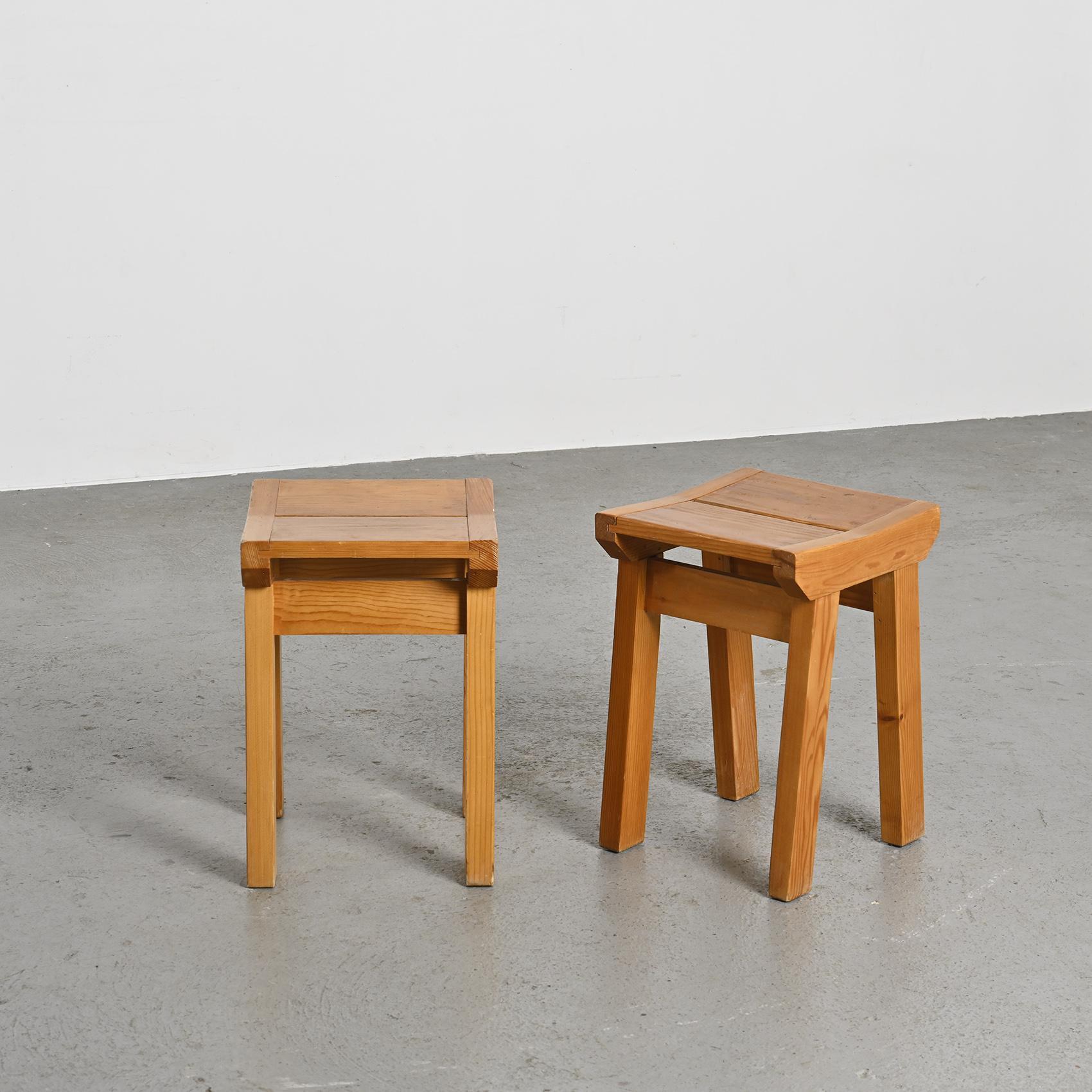 Pair of stools designed by Christian Durupt for the Les Arcs ski resort in the 1960s.

Crafted in solid wood, likely pine, these stools embody the functional simplicity and raw aesthetic characteristic of the mountain interiors conceived by