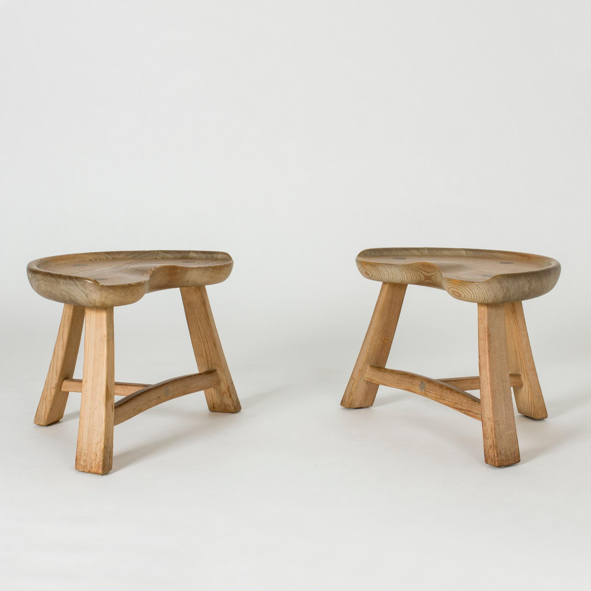Pair of lovely pine stools from Krogenäs Møbler. Wide seats with tractor design. Nice, decorative wooden plugs, great patina.