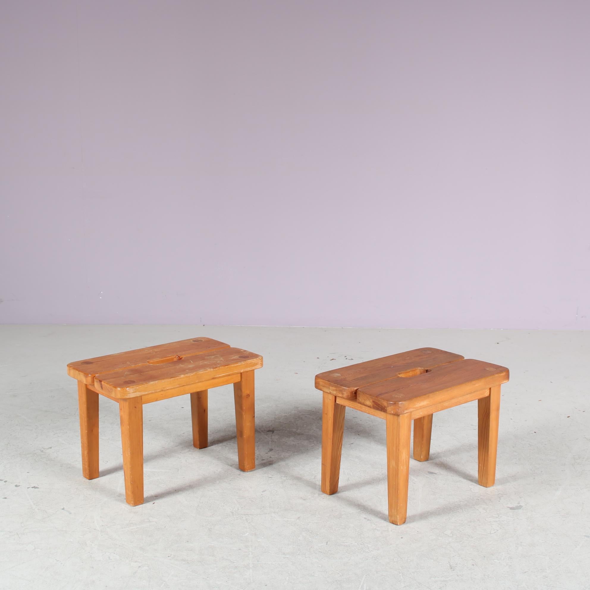 A beautiful pair of two small pine wooden stools, manufactured in Sweden around 1940.

Beautifuly made of high quality pine wood in a nice brown colour with a rustic style. The pieces have rectangular and gently tapered wooden legs, holding the