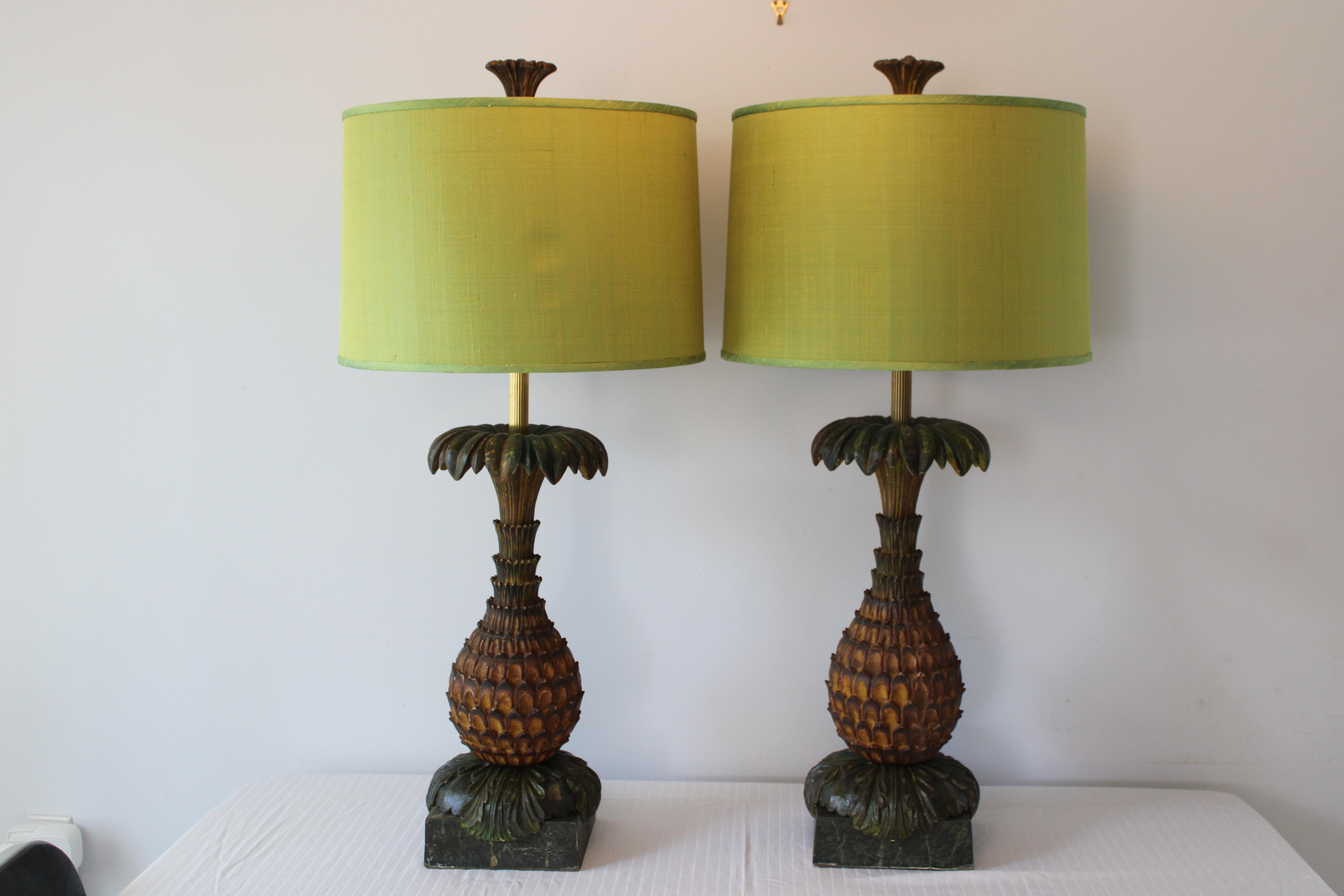 A matched pair of decorative wood pineapple lamps. We took a pair of decorative ornaments / posts and modified them to produce an elegant pair of lamps. Lamps measure 27
