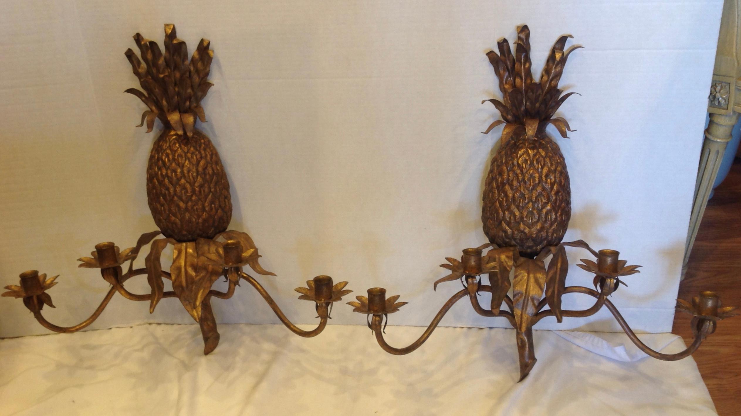 Chunky life size highly detailed with gilt accents and designed with 4 arms.
The sconces are whimsical and a perfect accent for tropical or island decor.