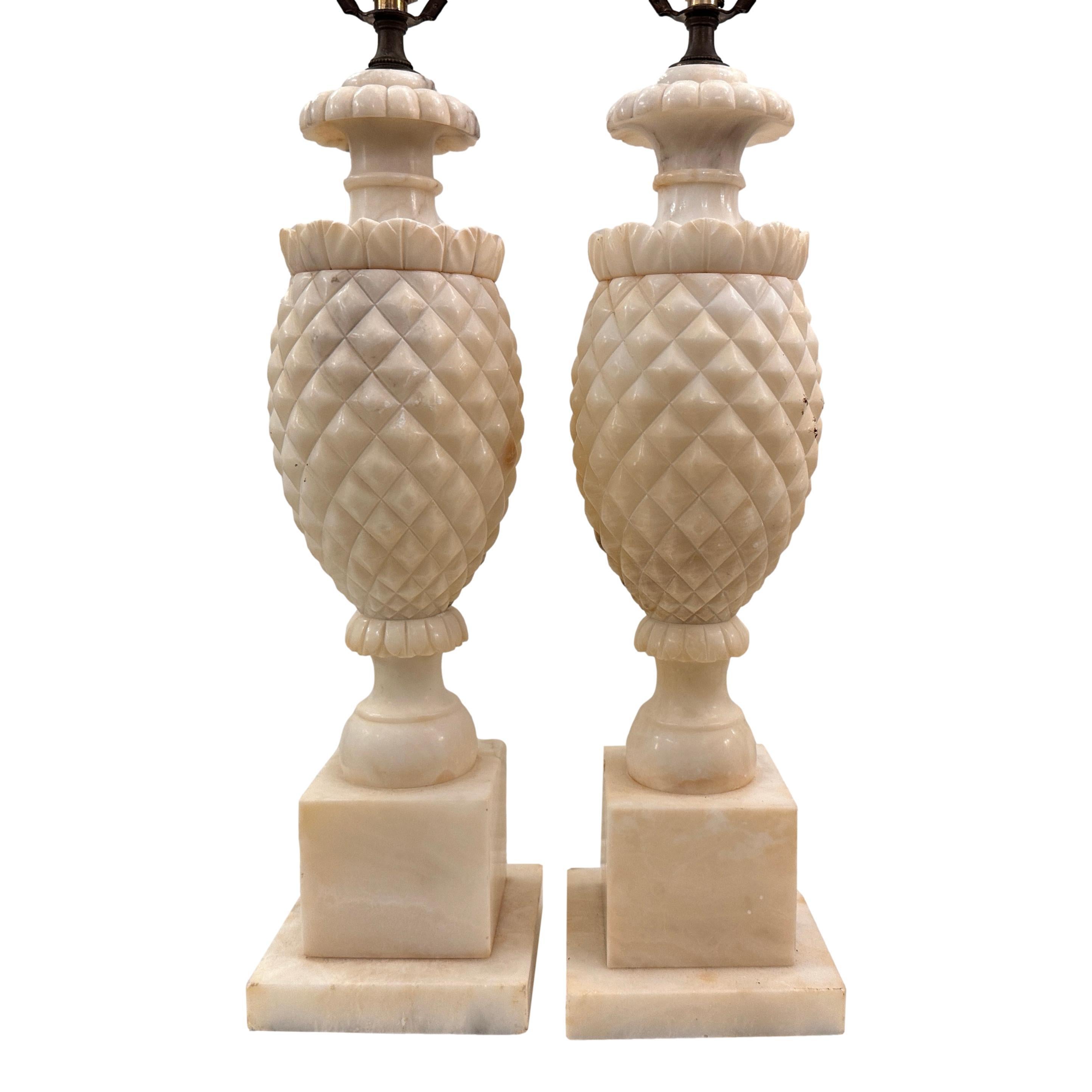 Pair of Italian circa 1950's carved alabaster lamps.

Measurements:
Height of body: 18