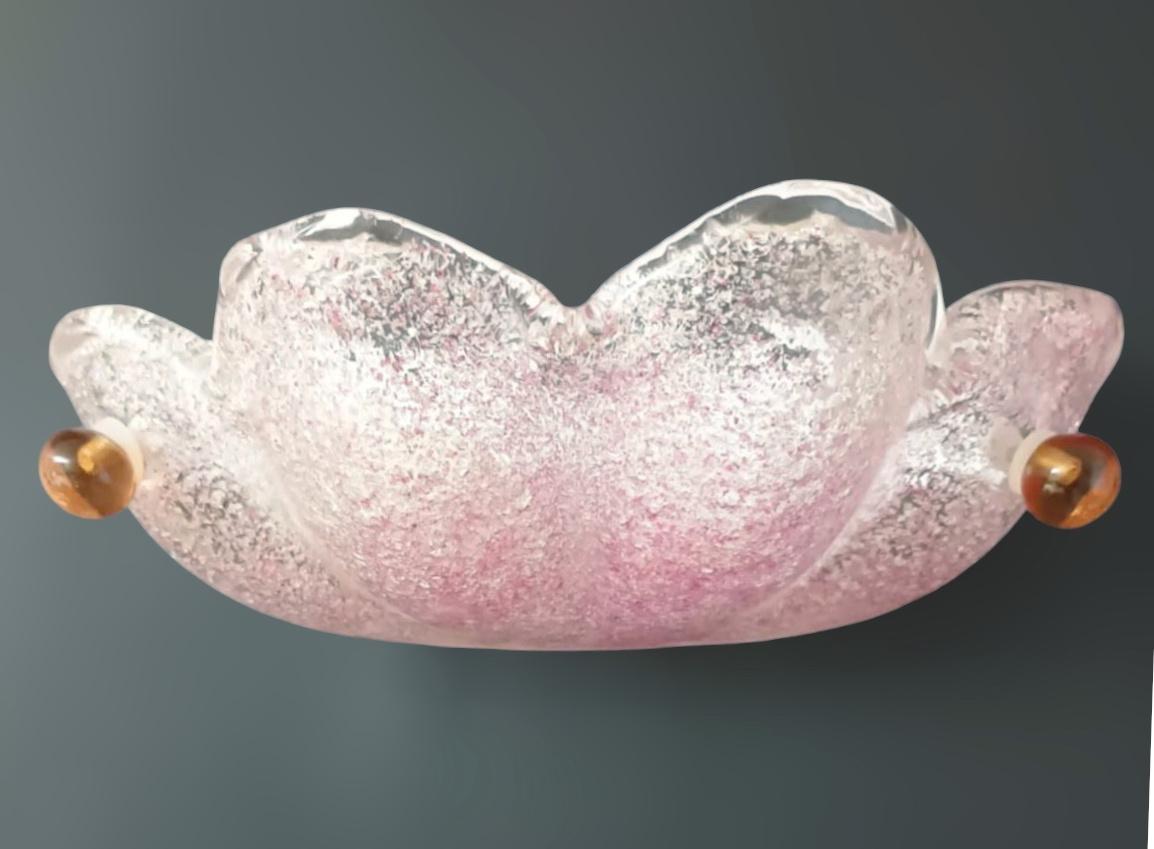 Italian wall light with a clear Murano glass shade hand blown with pink Graniglia to produce granular textured effect / Made in Italy in the style of Mazzega
Measures: Height 3 inches, width 12 inches, depth 5 inches
1 light / E12 or E14 type / max
