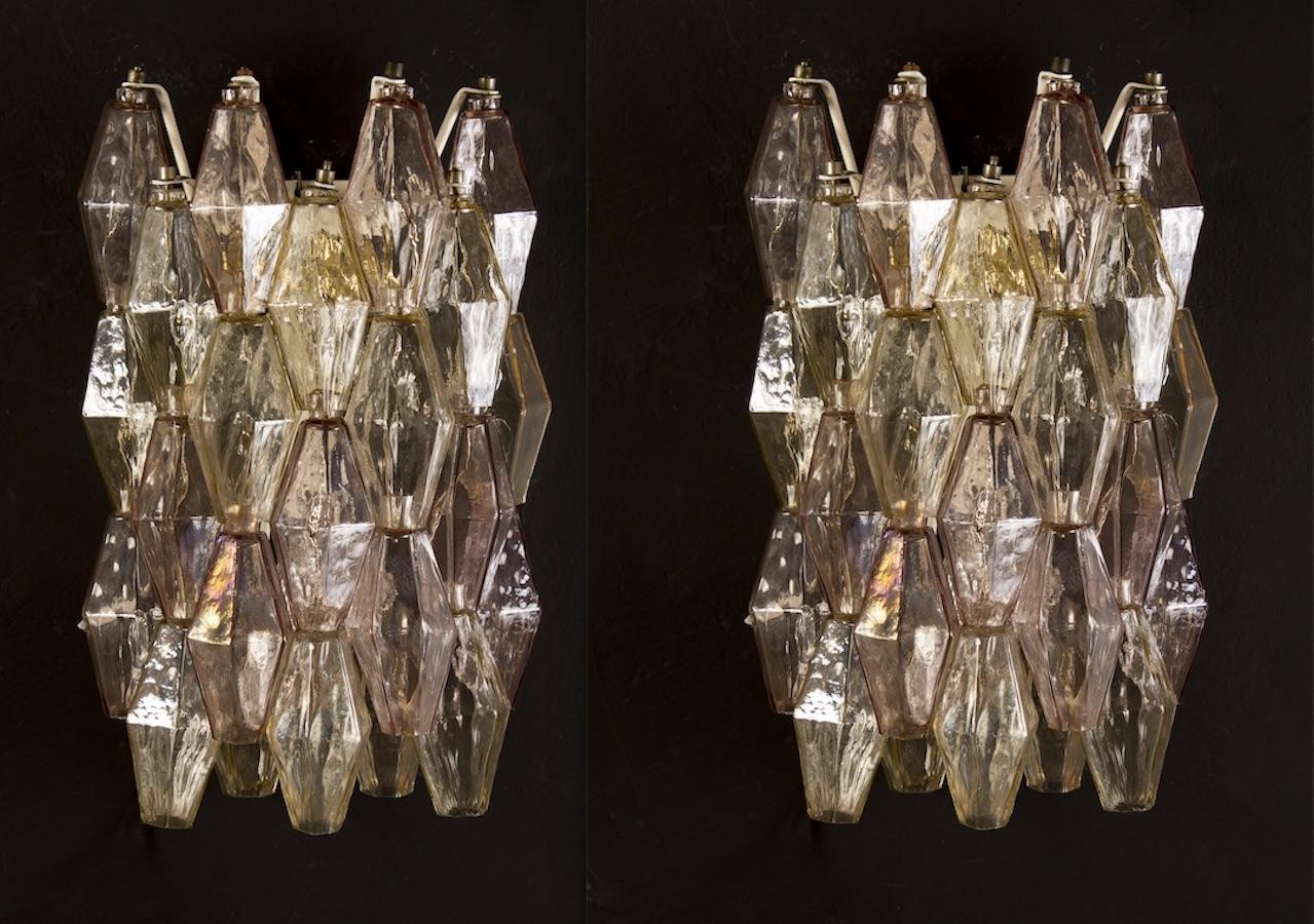 Amazing pair of poliedri wall lights. Rare combination of iridescent pink and amber  color Murano glass.
Available four pairs and also a chandelier.
Provenance form a historic Roman Palace of the period.
This light fixture can be disassembled and