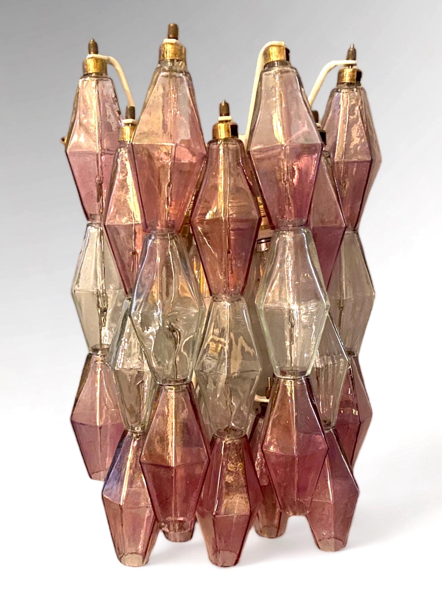 Amazing pair of poliedri wall lights. Rare combination of iridescent pink amethyst  and clear color Murano glass.
Available four pairs and also a chandelier.
Provenance form a historic Roman Palace of the period.
 
Cleaned and re-wired, in full