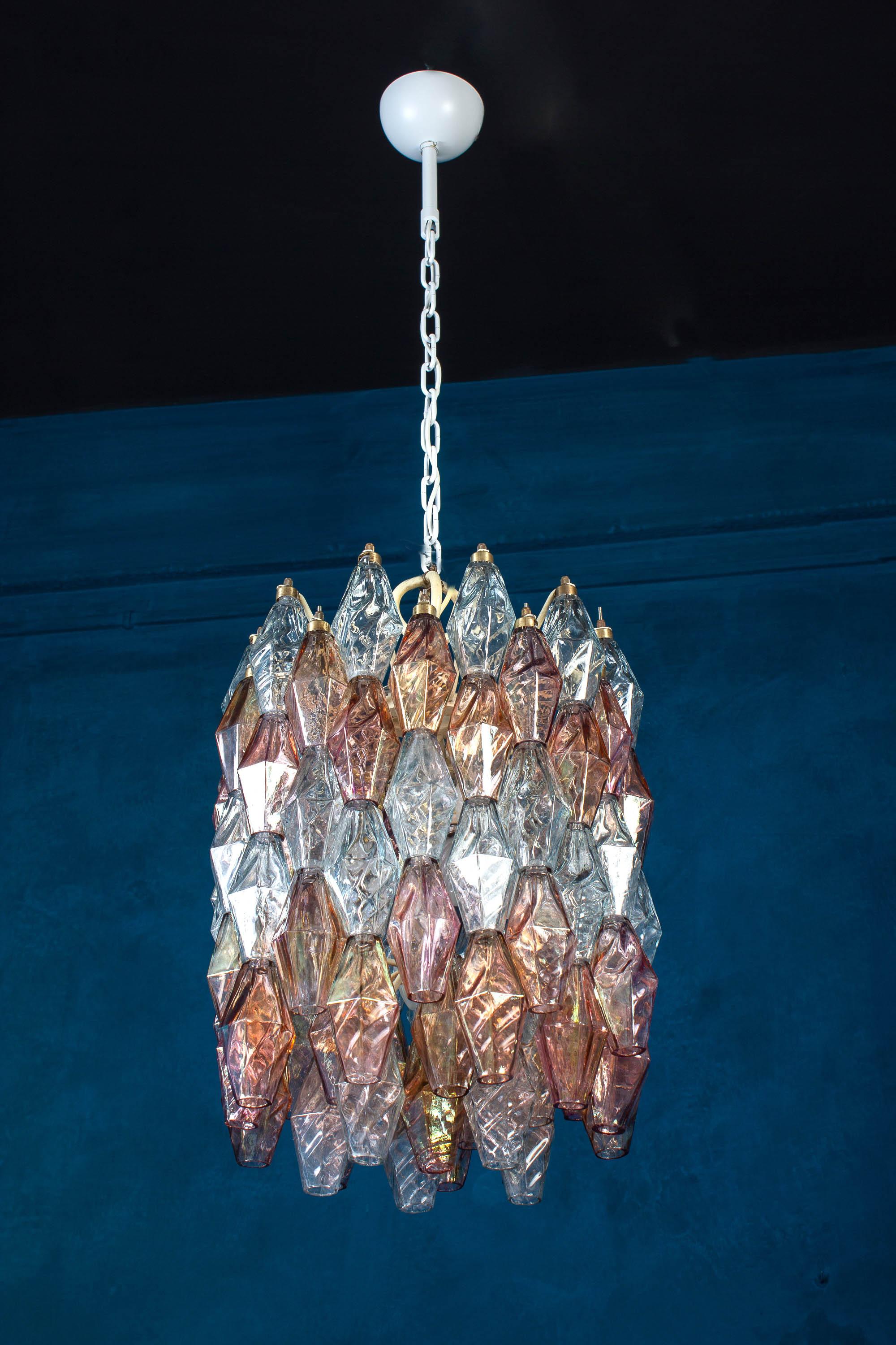 Fabulous pair of poliedri chandeliers, rare combination of iridescent pink and light blue color Murano glass.
Available four pairs and also 6 pair of sconces.
Provenance form a historic Roman Palace of the period.
Ivory painted frame in very good