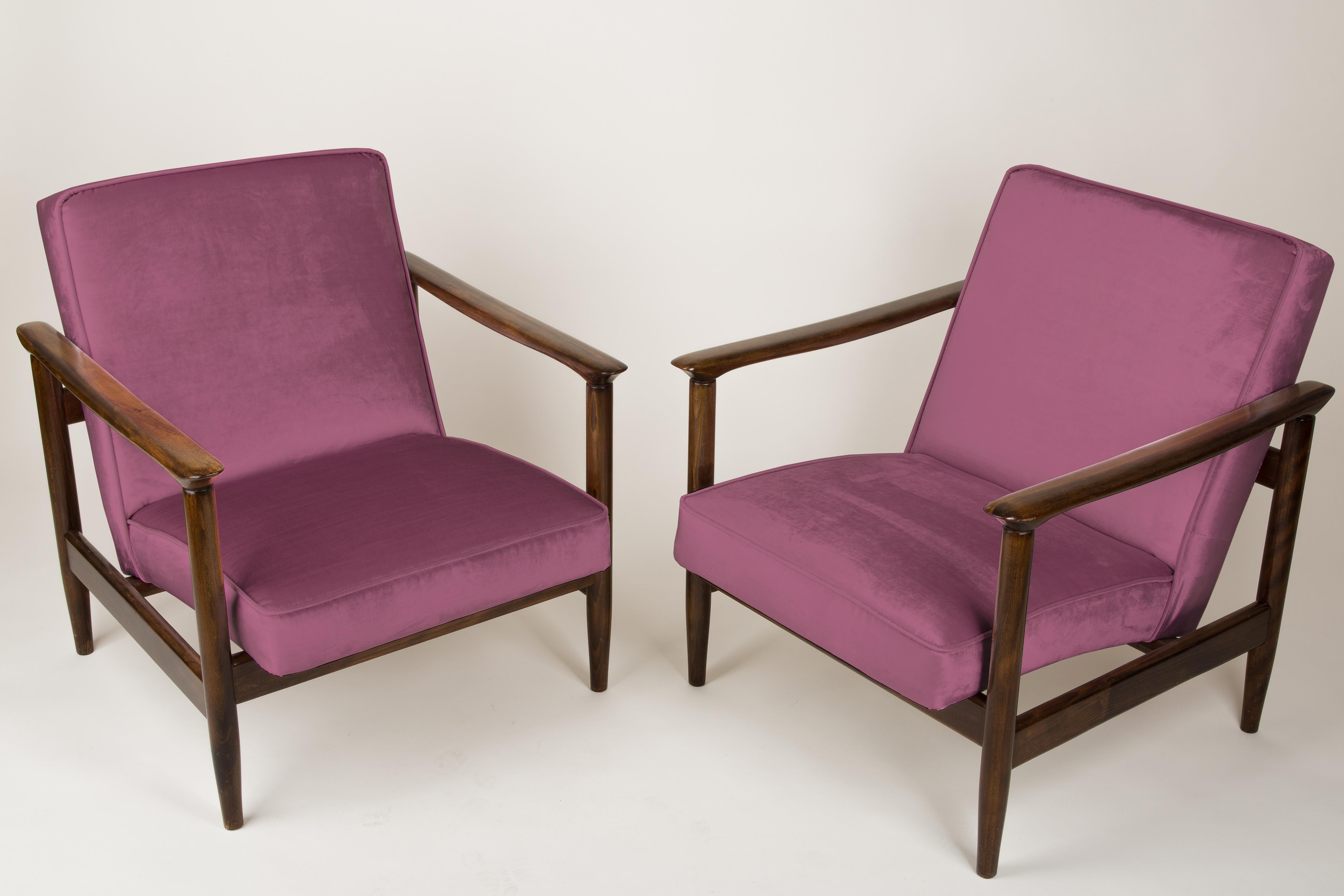 A pair of armchairs GFM-142, designed by Edmund Homa. The armchairs were made in the 1960s in the Goscieninska Furniture factory. They are made from solid beechwood. The GFM-142 armchair is regarded one of the best polish armchair design from the