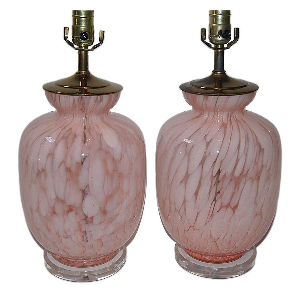 Pair of 1960s Italian blown glass lamps, pink and clear glass body. 
Lucite base. 
Measurements:
Height of body: 15