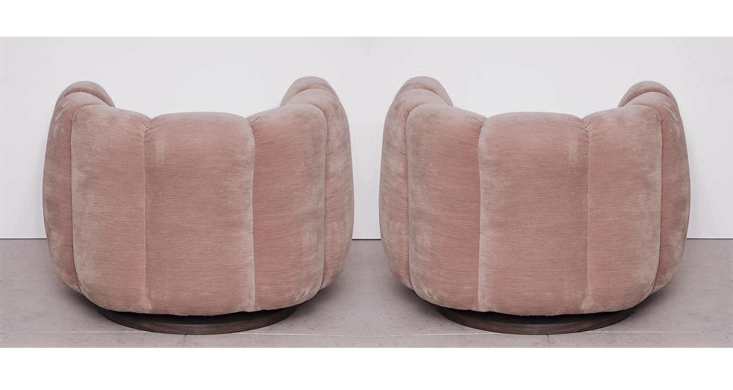 Mid-Century Modern Pair of Pink Channel Back Swivel Club / Lounge Chairs by Milo Baughman