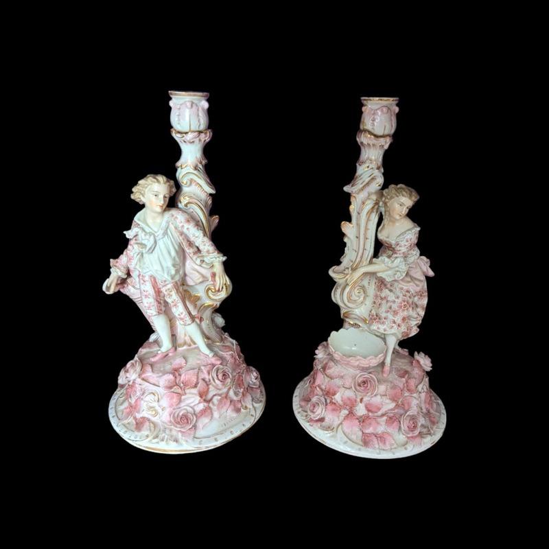 Here’s a description for your antique pair of Sitzendorf candelabra holders:

---

**Antique Pair of Late 19th Century Sitzendorf Pink Figural Floral Encrusted Candelabra Holders**

This exquisite pair of Sitzendorf candelabra holders, crafted in