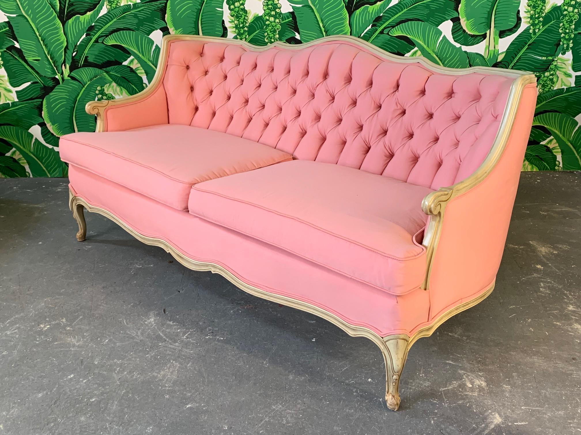 Fabulous pair of French Provincial style sofas newly upholstered in a pink durable heavyweight cotton fabric. Very good condition with only very minor imperfections consistent with age.