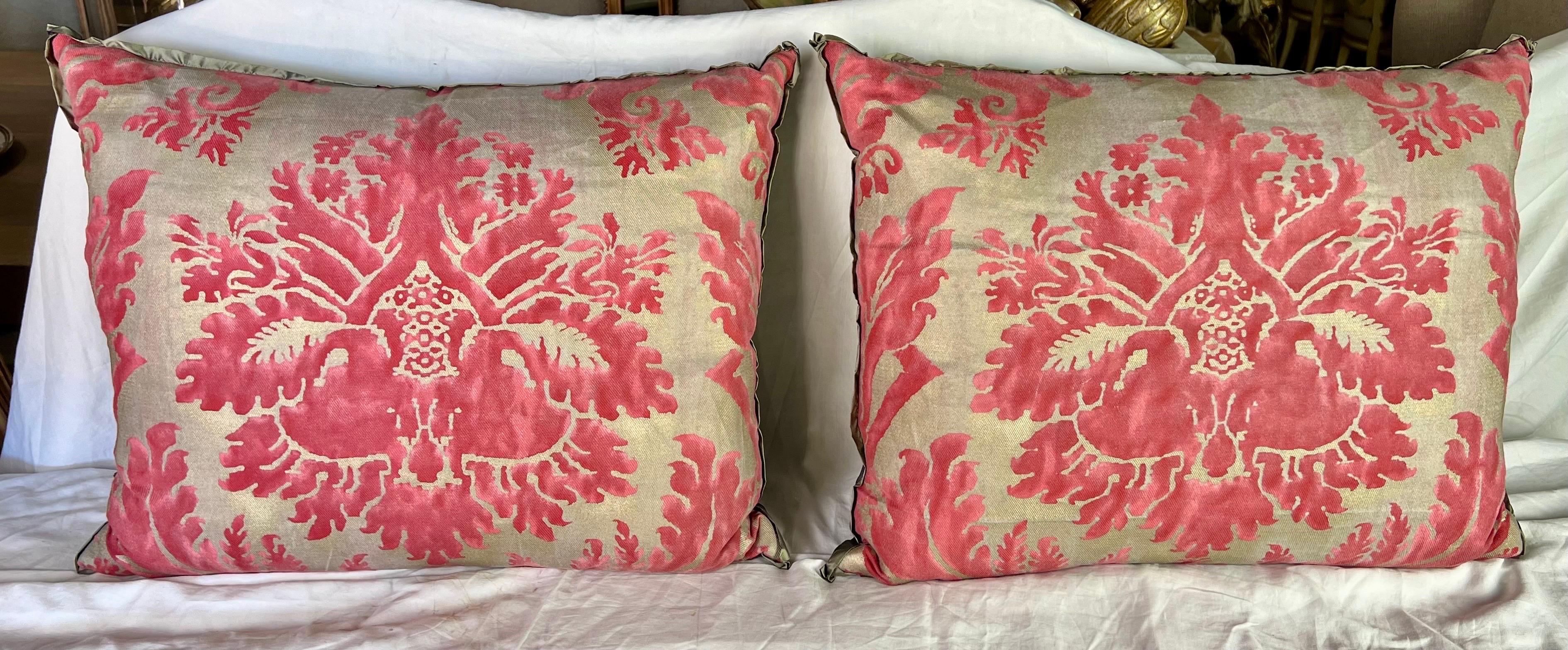 The combination of pink and gold Fortuny textile pillows from Italy featuring a gray silk back and down inserts, brings a luxurious touch and elegant contrast to your decor.