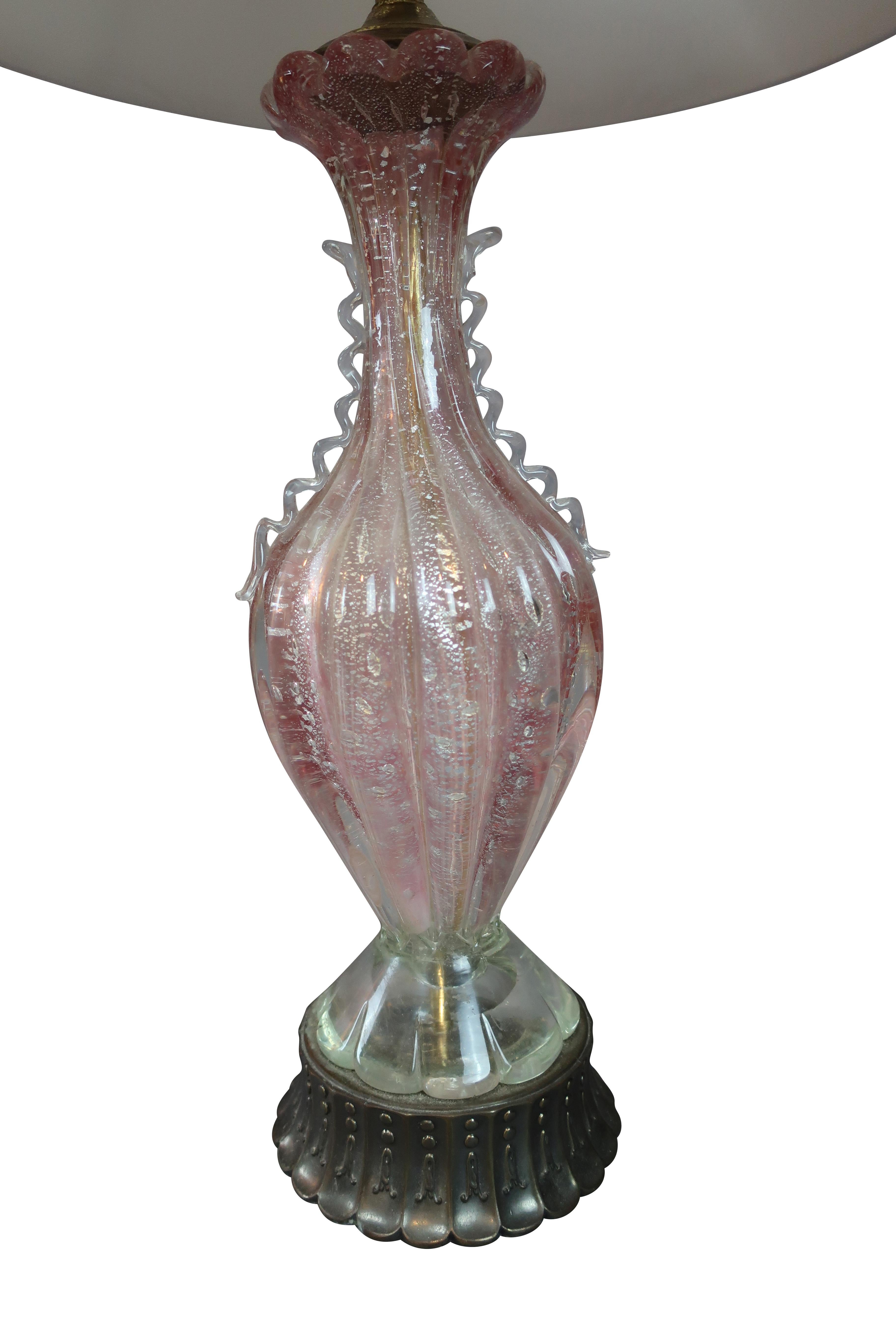 Pair of Italian Murano glass table lamps, baluster form, cased pink with silver bases, and custom silk white shades. Measures: 23 High by 7.0 diameter. Rewired to US 120V.