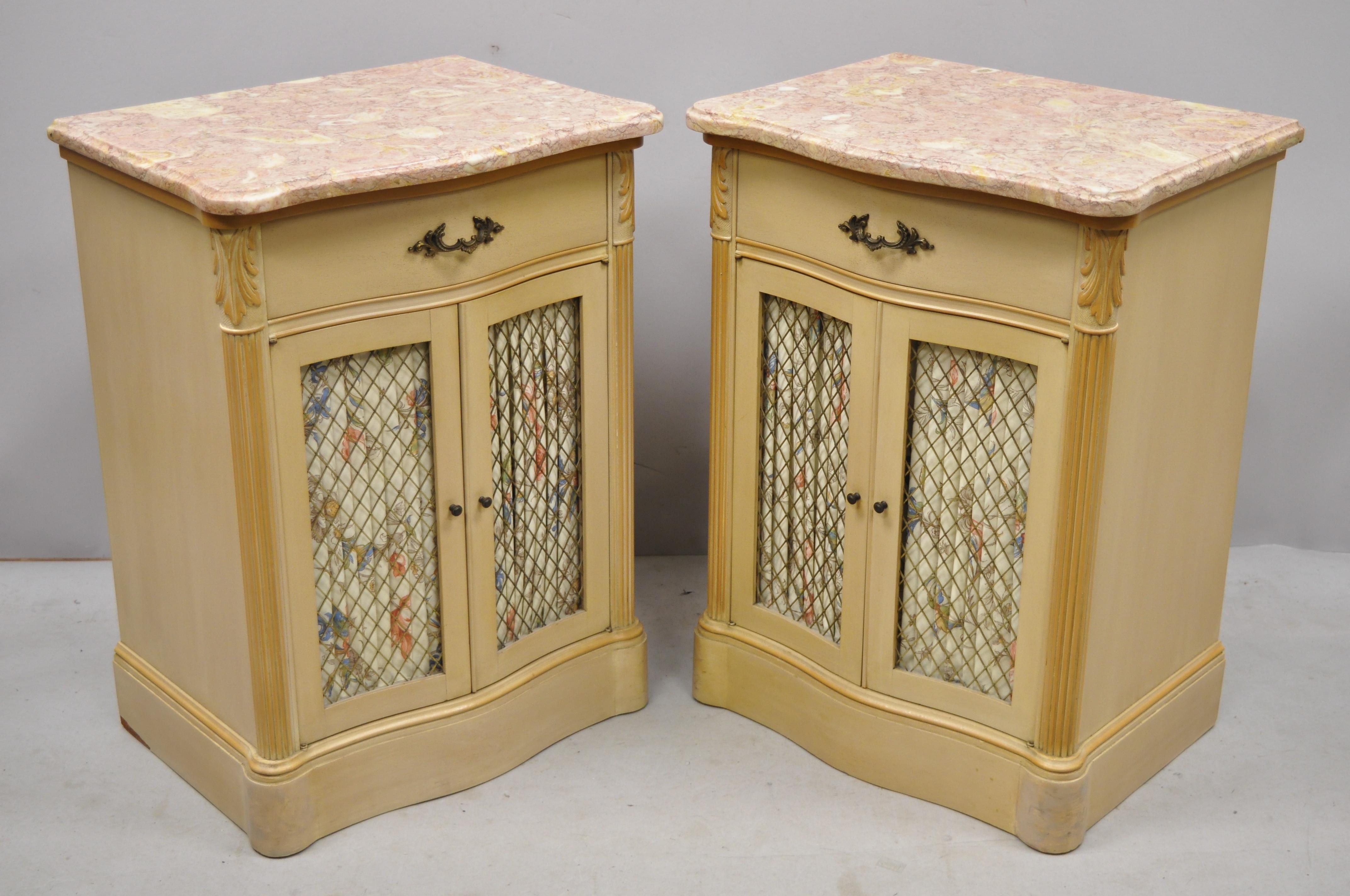 Pair of antique pink marble top serpentine front French Victorian style nightstands cabinets. Listing includes pink marble tops, brass lattice door fronts with curtains, serpentine fronts, 2 swing doors, 1 dovetailed drawer, quality American
