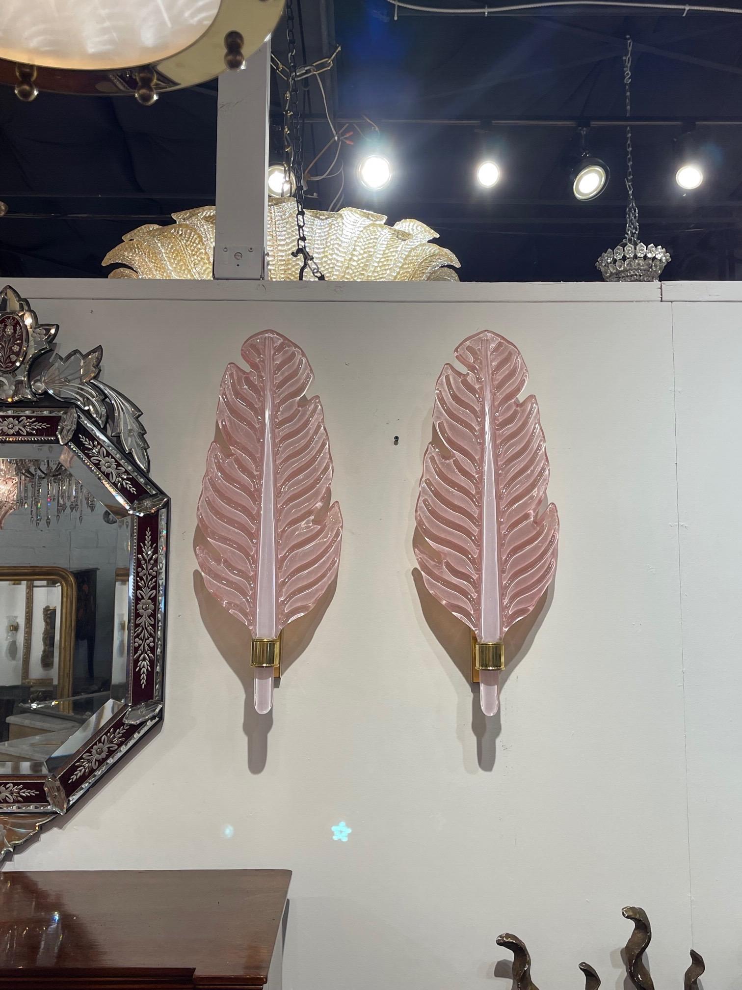 Stylish pair of pink Murano glass and brass leaf form wall sconces. Adds a beautiful decorative touch!